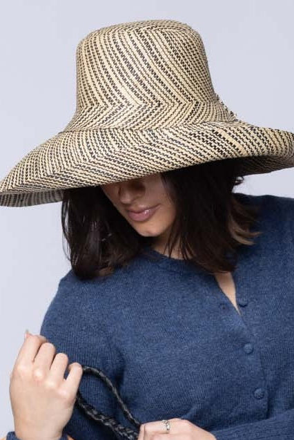 Model wearing Monica 5 inch or 7 inch Wide Brim Natural Two Tone Melange Packable Straw Sun Hat handmade loomed raffia in a multicolor heathered melange pattern of black and natural straw color creates a subtle swirl - Shebobo