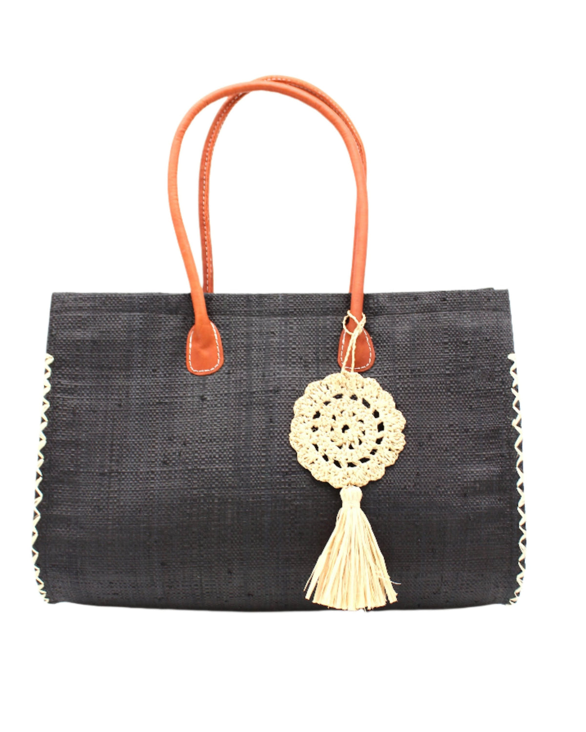 Monte Carlo Big Straw Beach Bag with Dreamcatcher Tassel Charm Embellishment handmade loomed raffia palm fiber in a solid hue of black with contrasting crosshatch stitch edging in natural straw color with matching crochet dreamcatcher disc and tuft tassel charm embellishment and leather handles oversized large handbag shoulder bag - Shebobo