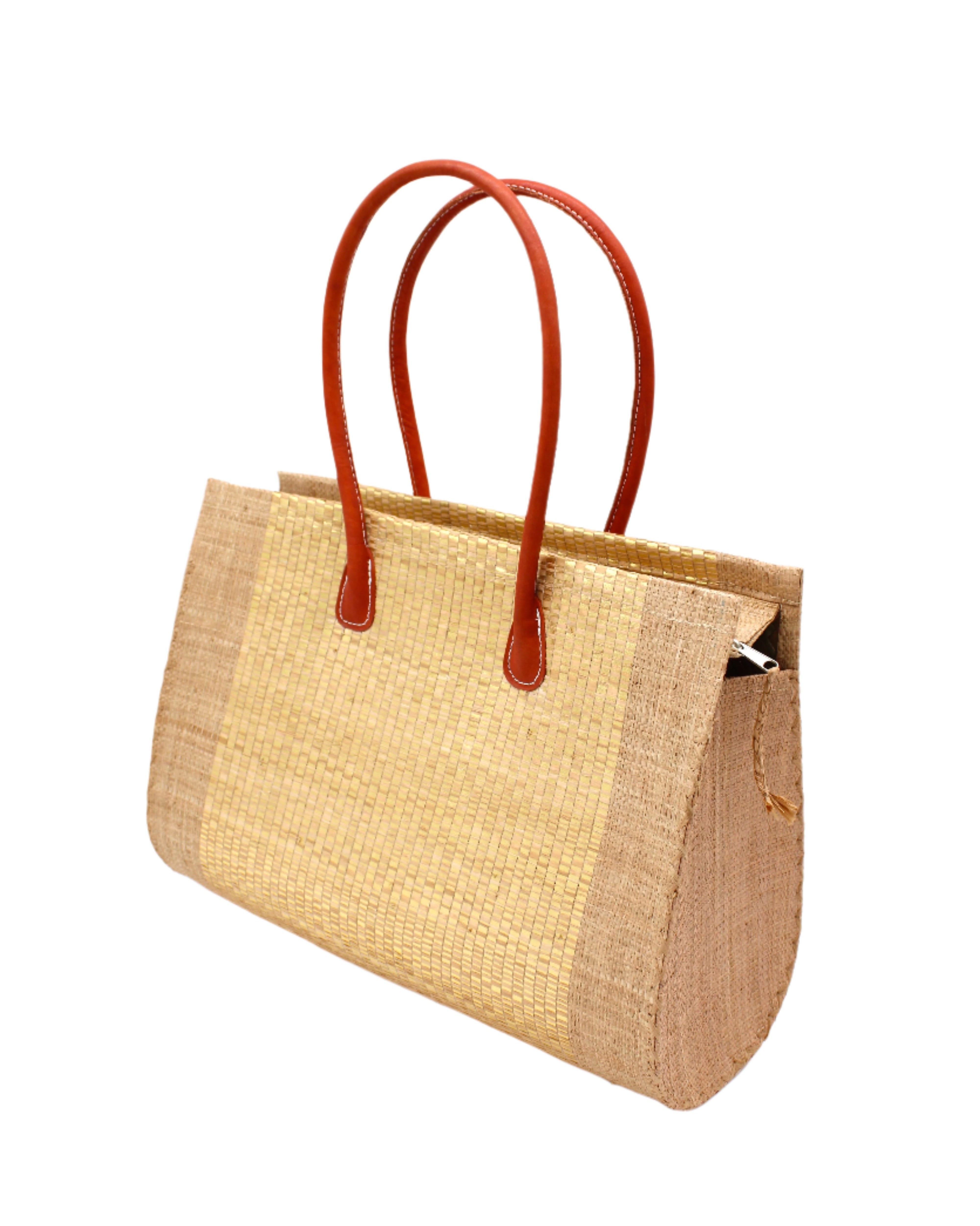 Side view Monte Carlo Wynwood Big Straw Beach Bag with Metallic Detailing Cappuccino Shoulder Bag handmade loomed raffia palm fiber in a solid hue of cappuccino light/brown/beige with incorporated woven in vegan leather gold metallic strands and leather handles purse - Shebobo
