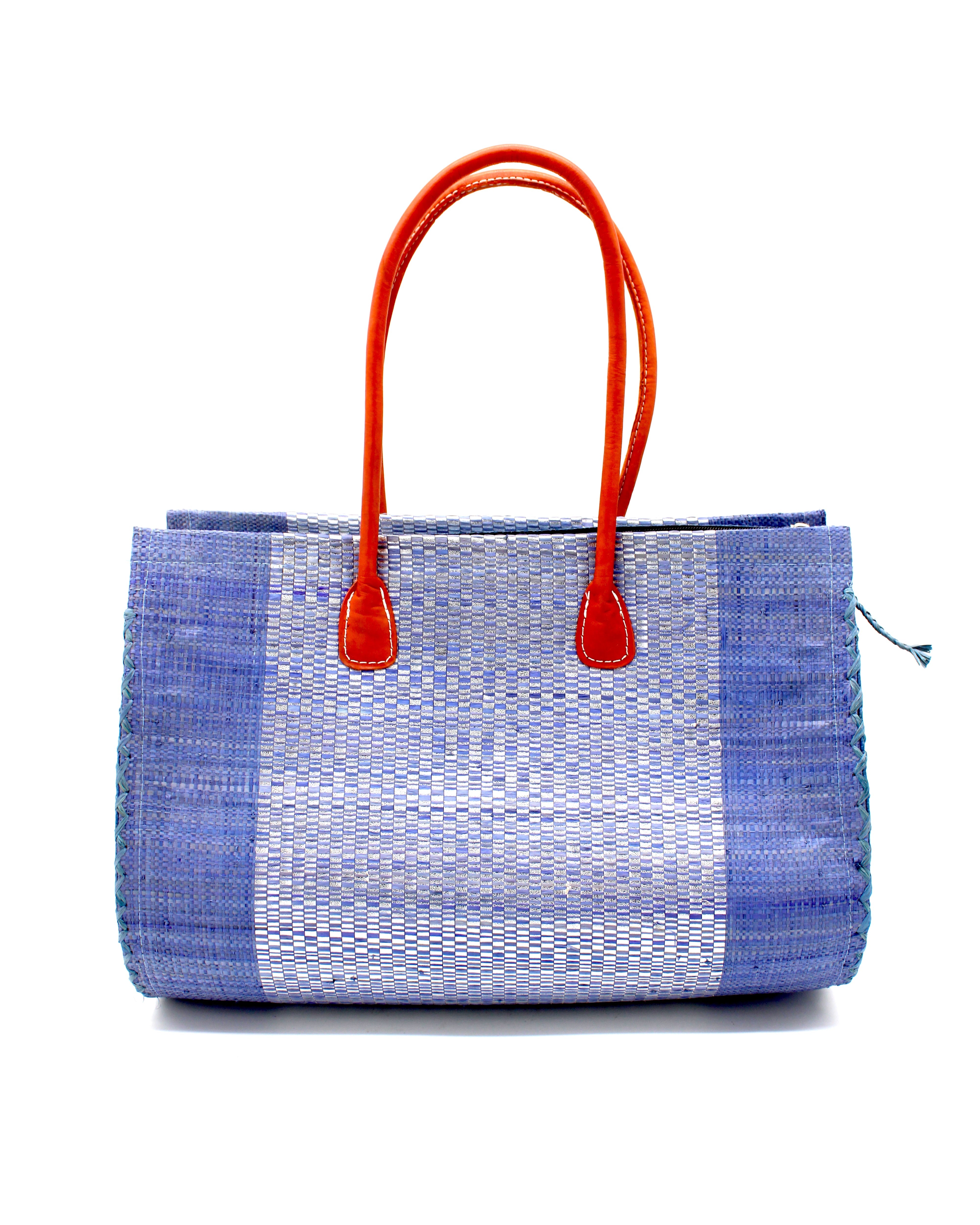Monte Carlo Wynwood Big Straw Beach Bag with Metallic Detailing Denim Shoulder Bag handmade loomed raffia palm fiber in a solid hue of denim retro/light blue with incorporated woven in vegan leather silver metallic strands and leather handles purse - Shebobo