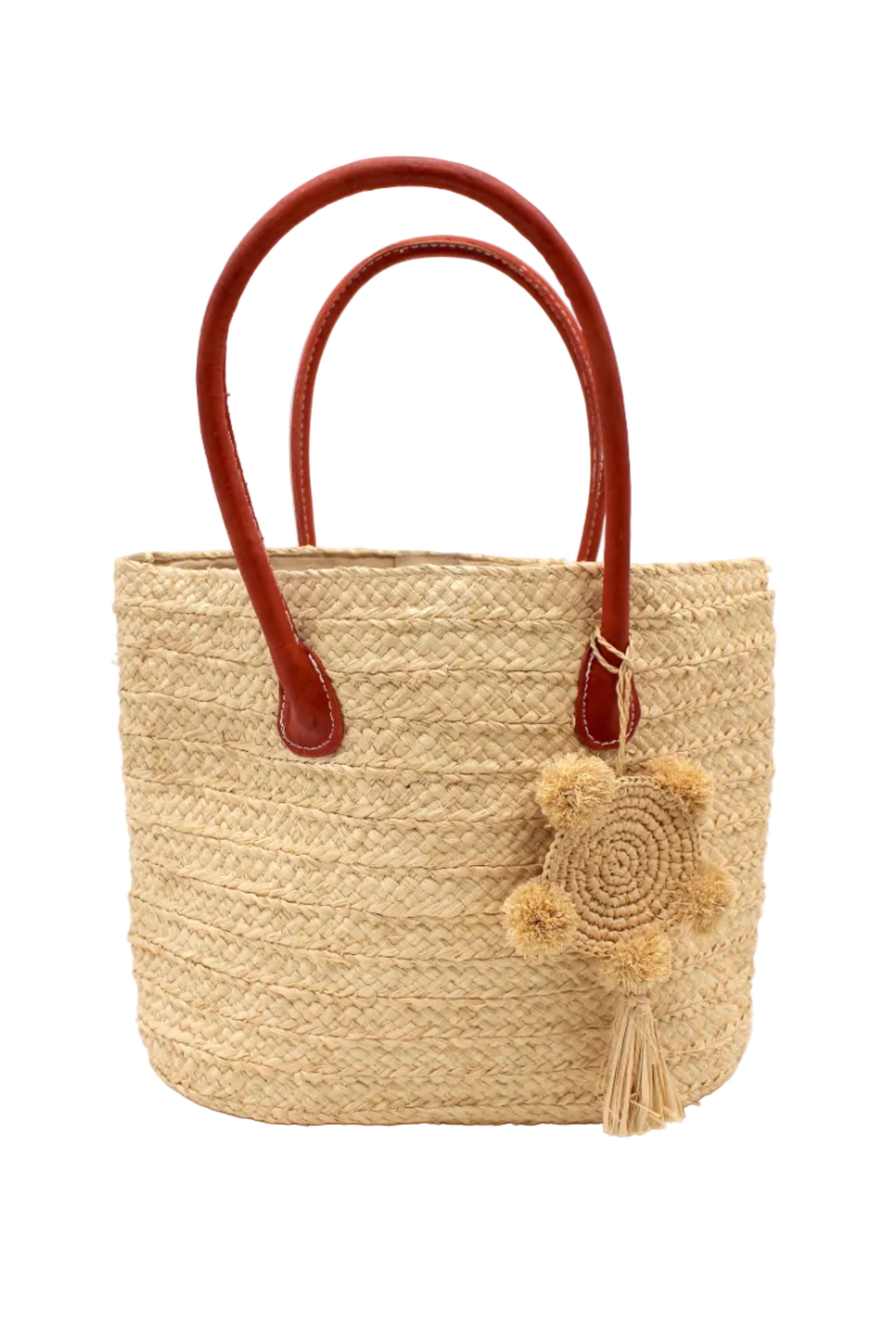 Nomena Braided Straw Basket Handbag handmade braided natural raffia palm fiber in a solid hue of natural straw color woven into concentric horizontal bands of subtle texture spiraling around the bag with leather handles beach bag shoulder bag purse with matching crochet dreamcatcher pompom and tassel charm embellishment - Shebobo