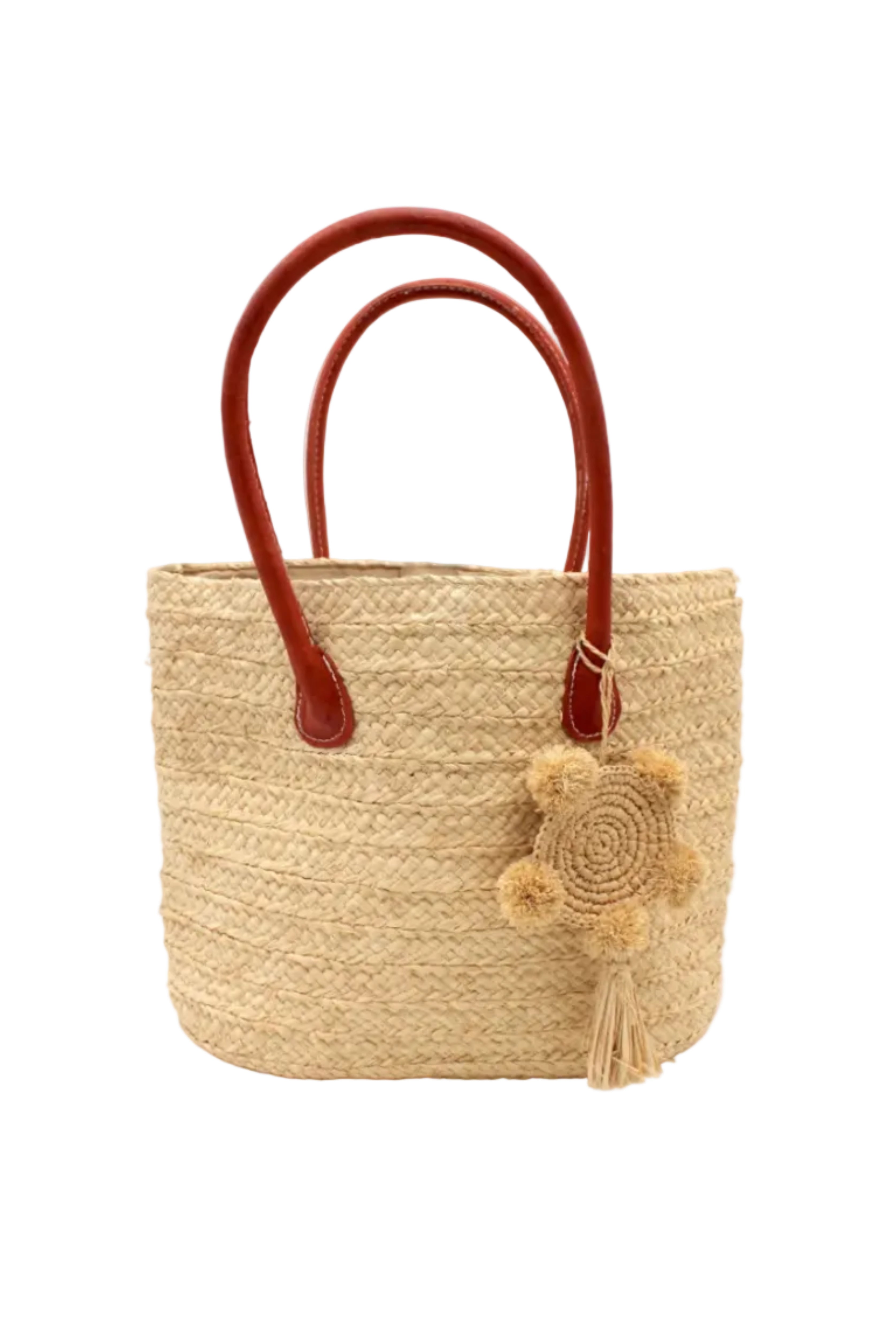 Nomena Braided Straw Basket Handbag handmade braided natural raffia palm fiber in a solid hue of natural straw color woven into concentric horizontal bands of subtle texture spiraling around the bag with leather handles beach bag shoulder bag purse with matching crochet dreamcatcher pompom and tassel charm embellishment - Shebobo