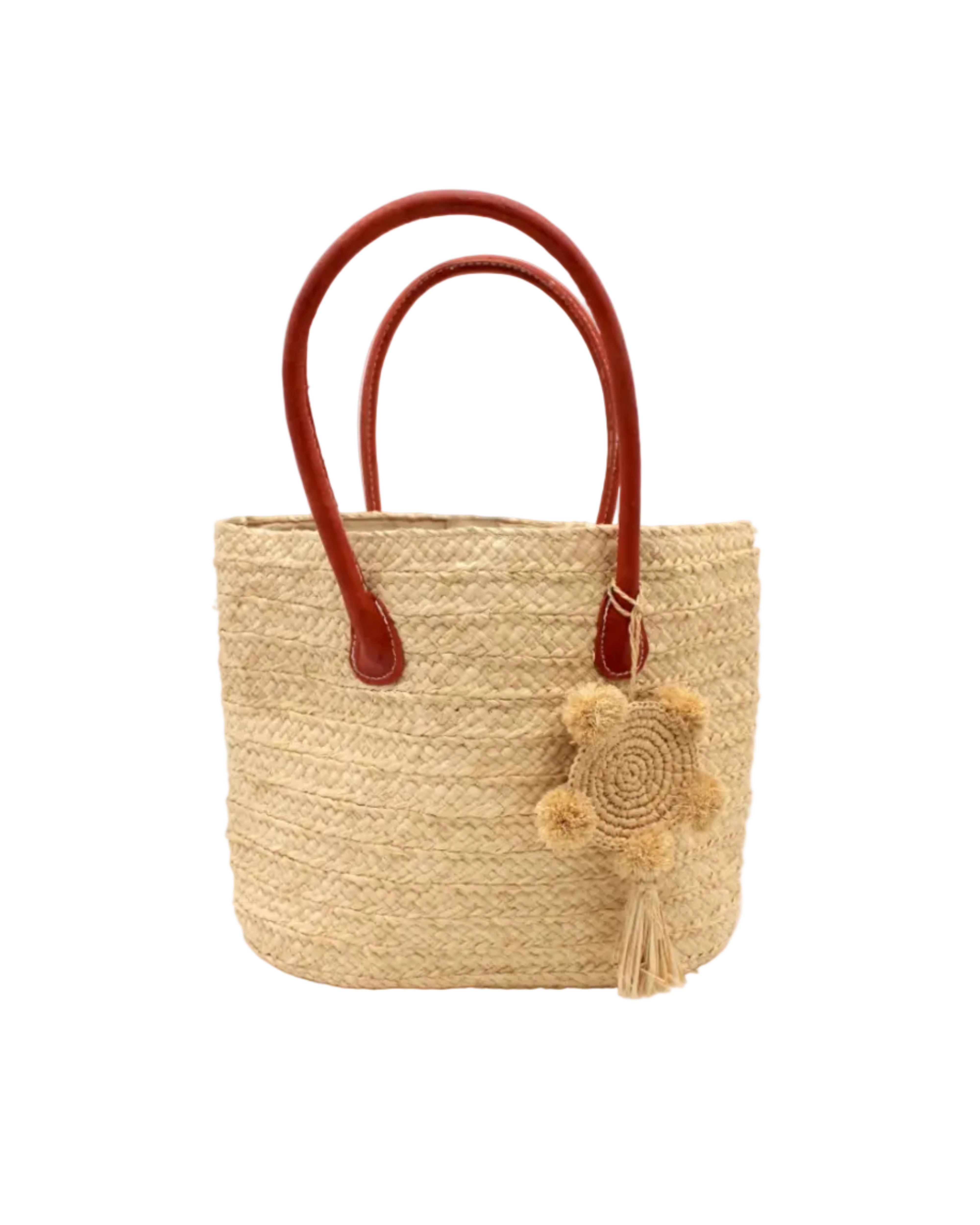 Nomena Braided Straw Basket Handbag handmade braided natural raffia palm fiber in a solid hue of natural straw color woven into concentric horizontal bands of subtle texture spiraling around the bag with leather handles beach bag shoulder bag purse with matching crochet dreamcatcher pompom and tassel charm embellishment - Shebobo