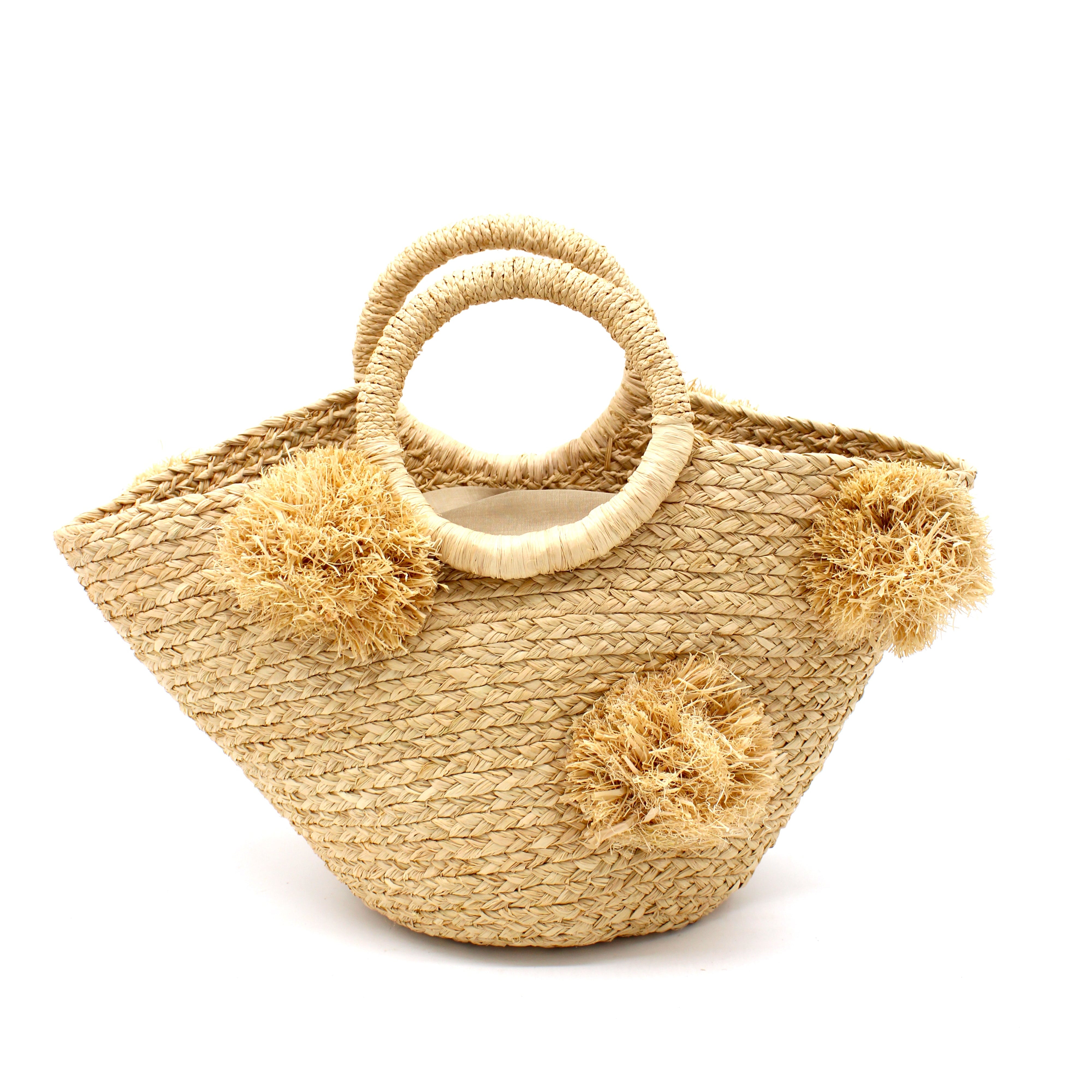 Phi Phi Natural Braided Straw Basket with Oversized Raffia Poufs handmade raffia palm fiber braided into a solid hue of natural straw color with three randomly placed matching hand-brushed fringe poufs per side for embellishment with loop wrap top edging and crochet loop/braided handles bag handbag - Shebobo