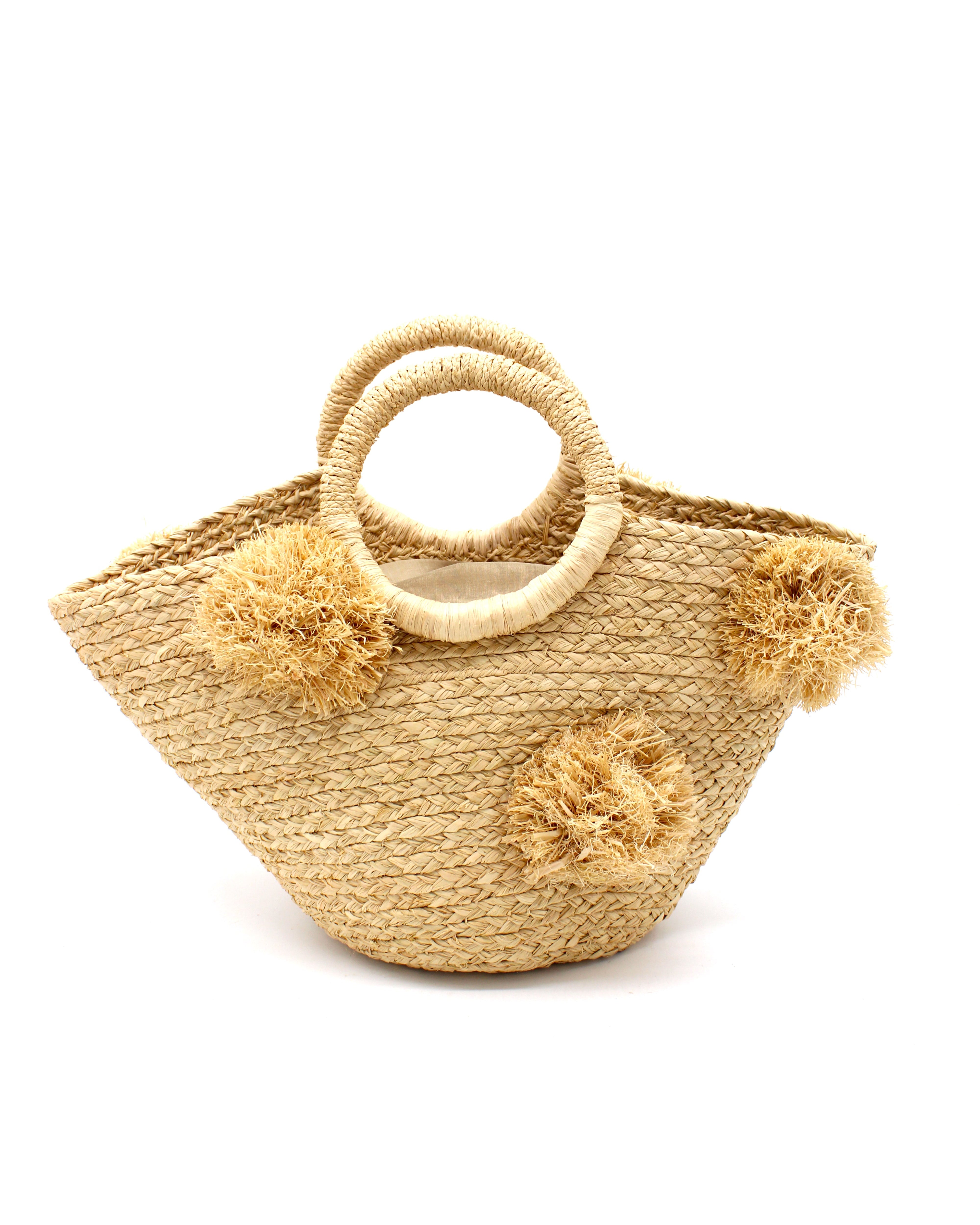 Phi Phi Natural Braided Straw Basket with Oversized Raffia Poufs handmade raffia palm fiber braided into a solid hue of natural straw color with three randomly placed matching hand-brushed fringe poufs per side for embellishment with loop wrap top edging and crochet loop/braided handles bag handbag - Shebobo