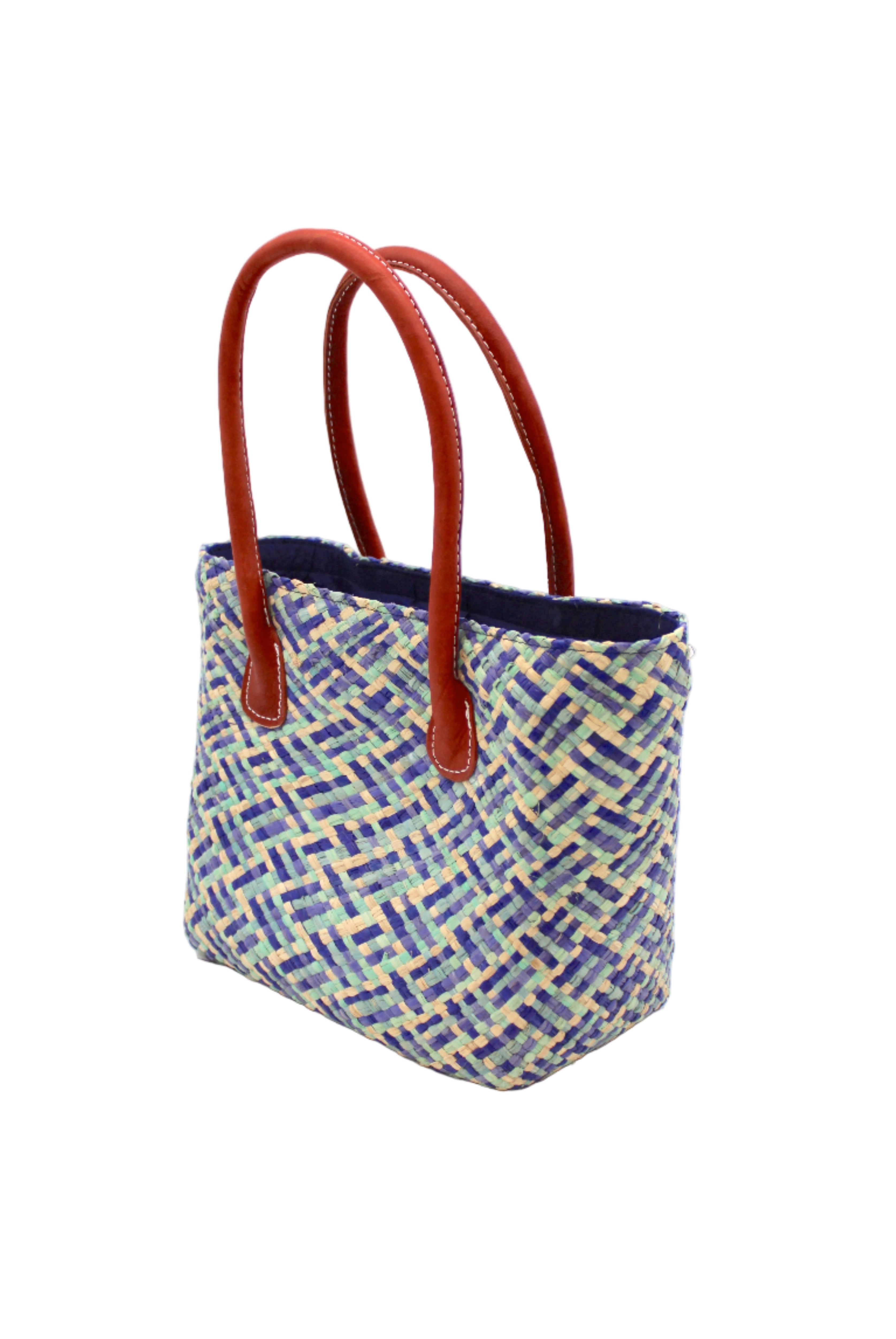 Side view Pianina Azure Multi Small Straw Basket Bag handmade from woven natural raffia palm fiber in a multicolor cross weave pattern of turquoise, denim retro/light/blue, natural straw color, and navy blue handbag purse with leather handles - Shebobo