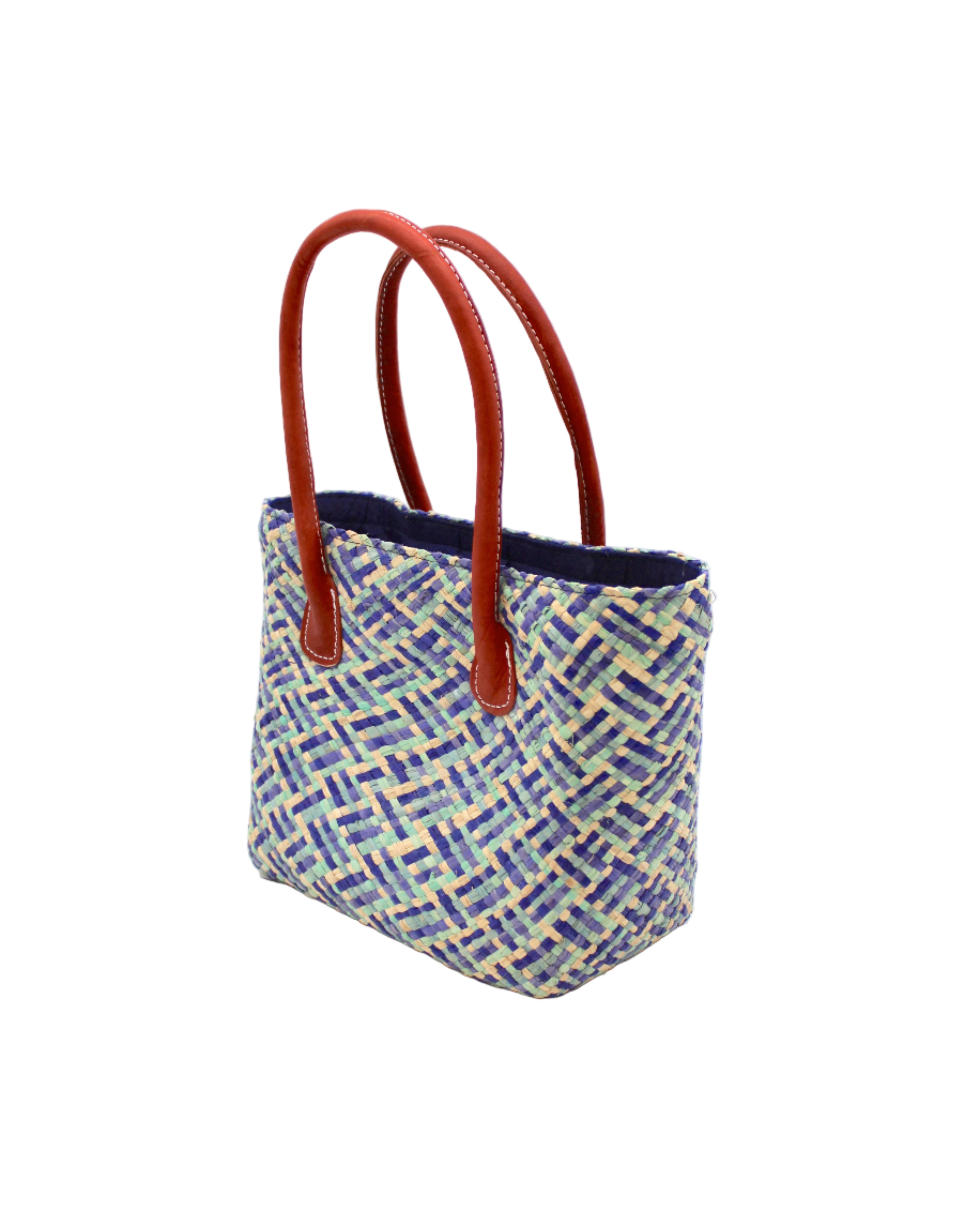 Side view Pianina Azure Multi Small Straw Basket Bag handmade from woven natural raffia palm fiber in a multicolor cross weave pattern of turquoise, denim retro/light/blue, natural straw color, and navy blue handbag purse with leather handles - Shebobo