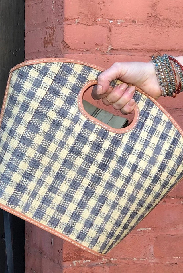 Model wearing Ricky Grey Gingham Straw Bucket Handbag handmade loomed raffia purse grey and natural straw color plaid pattern bag - Shebobo
