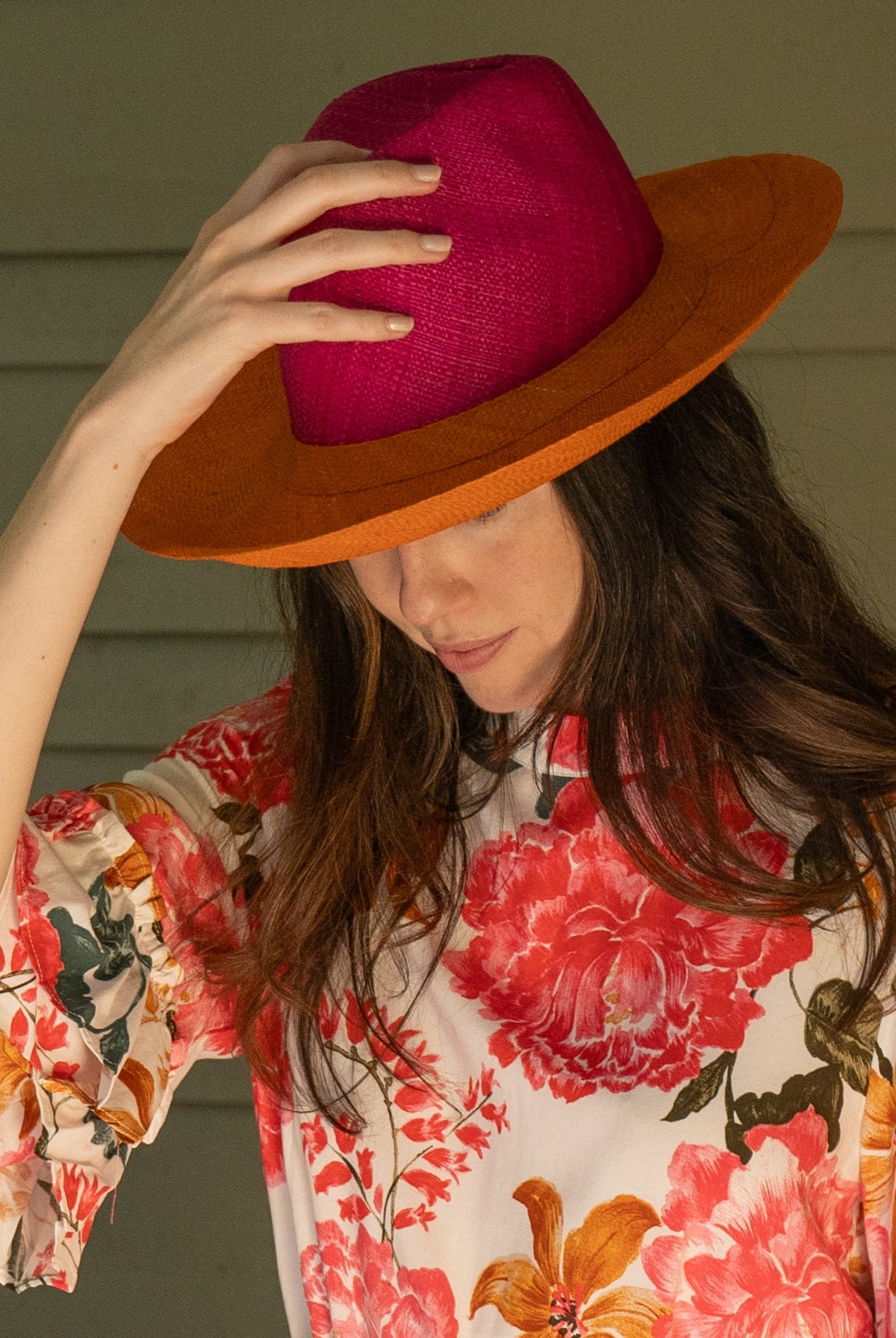 Model wearing Riley 3" Brim Panama Unisex Two Tone Straw Hats handmade loomed raffia palm fiber in a solid hue of fuchsia hot/bright/barbie/pink on the crown and solid coral orange/red on the brim with matching attached hat band lightweight breathable uv/sun protection straw sun hat - Shebobo