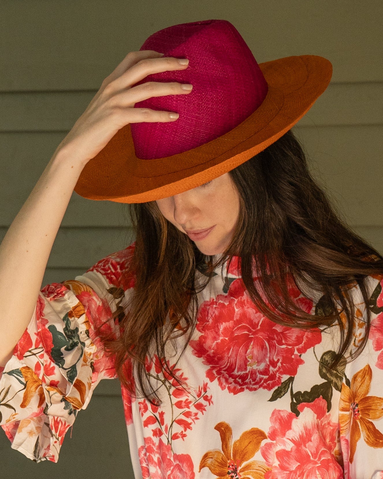 Model wearing Riley 3" Brim Panama Unisex Two Tone Straw Hats handmade loomed raffia palm fiber in a solid hue of fuchsia hot/bright/barbie/pink on the crown and solid coral orange/red on the brim with matching attached hat band lightweight breathable uv/sun protection straw sun hat - Shebobo
