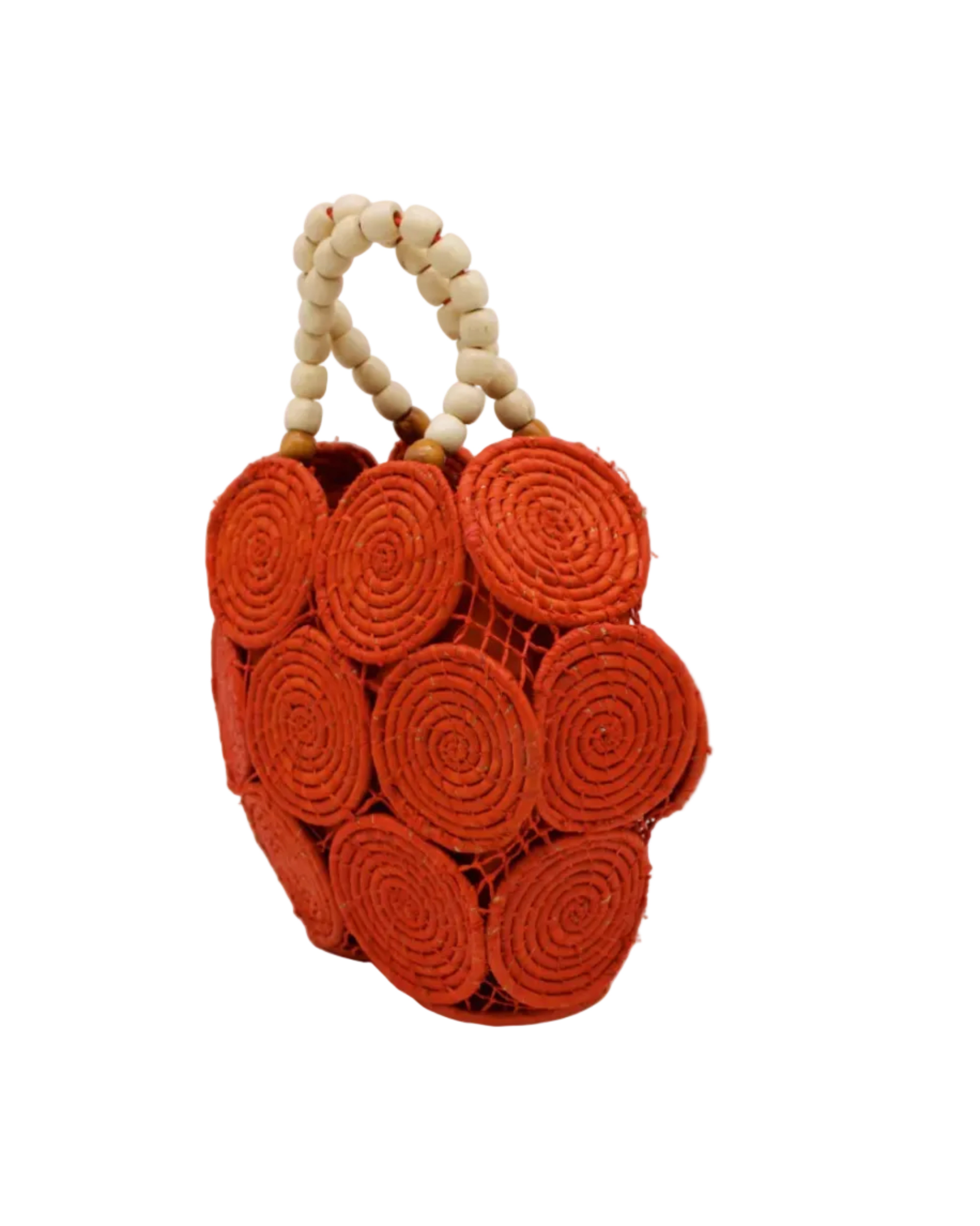 Side view Romy Coral Crochet Disc Straw Handbag with Wooden Bead Handles handmade natural raffia palm fiber in a solid hue of coral orange/red in a crochet coiled circular flat disc attached together with macrame knot technique with a geometric hexagonal overall shape with seven discs per side two above and below a horizontal row of three per side and a single row comprising the side of the bag with beige carved round wooden beaded handles purse - Shebobo