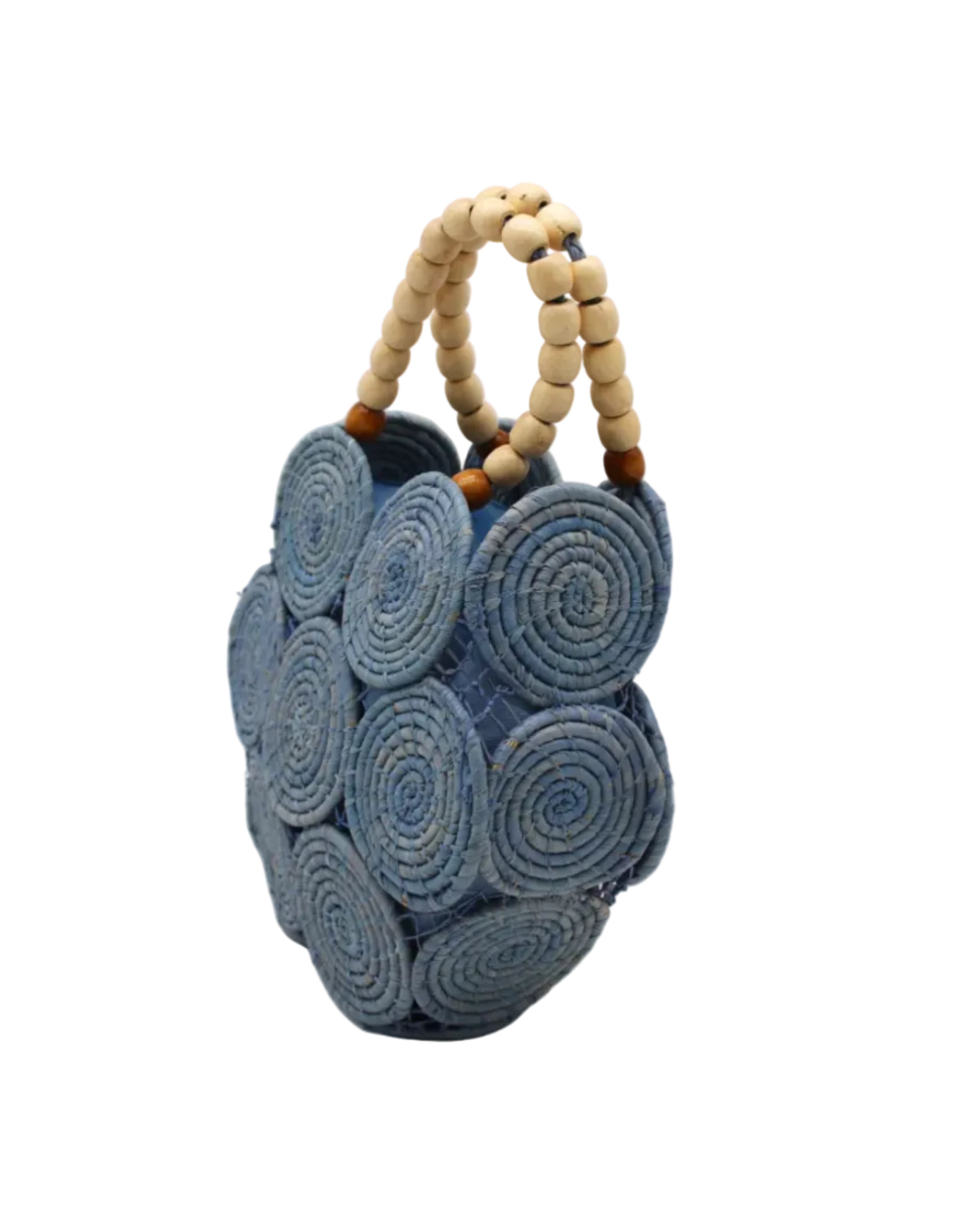 Side view Romy Denim Crochet Disc Straw Handbag with Wooden Bead Handles handmade natural raffia palm fiber in a solid hue of denim retro/light/blue in a crochet coiled circular flat disc attached together with macrame knot technique with a geometric hexagonal overall shape with seven discs per side two above and below a horizontal row of three per side and a single row comprising the side of the bag with beige carved round wooden beaded handles purse - Shebobo