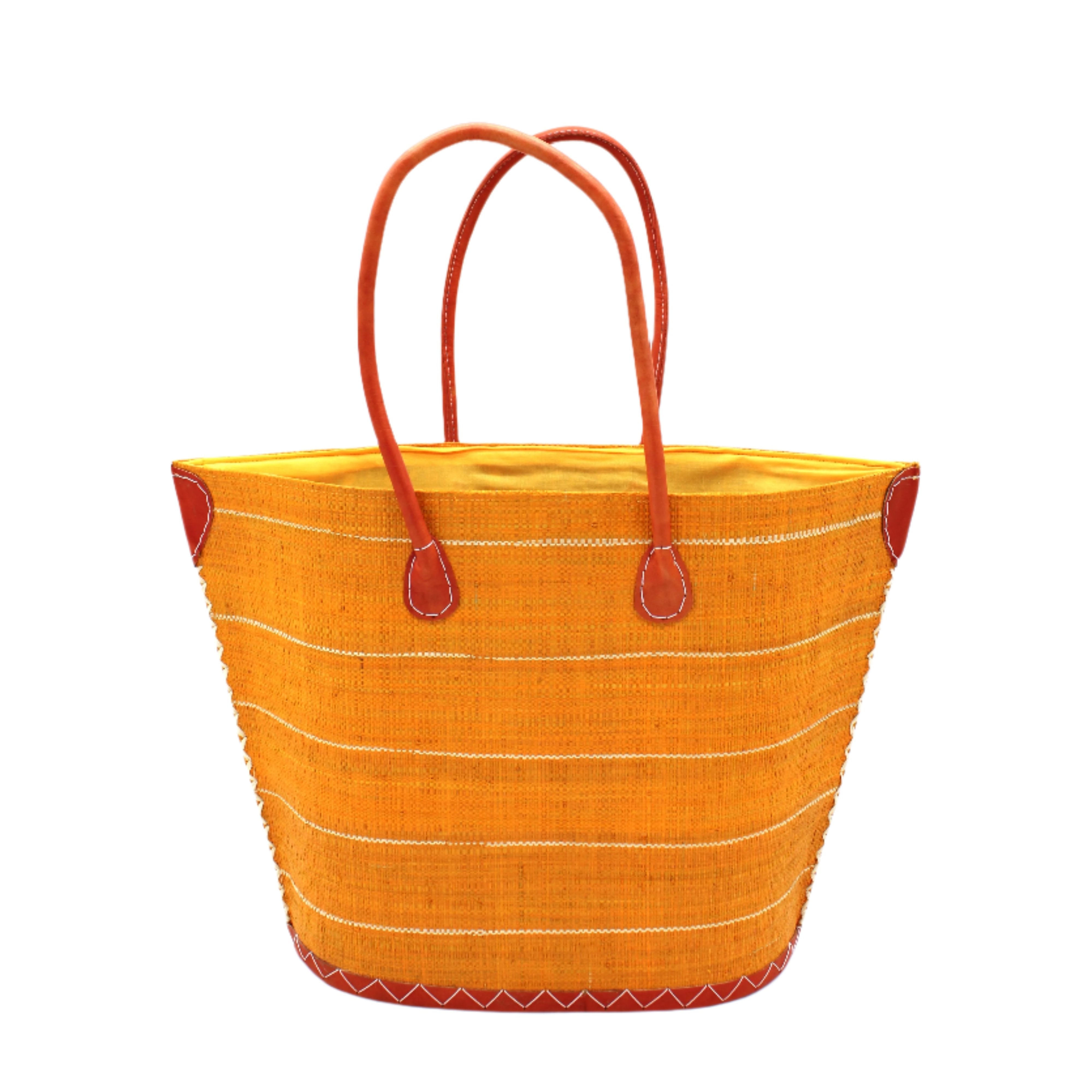 Santa Cruz Saffron Pinstripes Small Straw Tote Bag handmade loomed raffia in a horizontal pinstripe pattern of wide bands of saffron yellow/orange with narrow natural straw color bands handbag with leather handles and accents - Shebobo