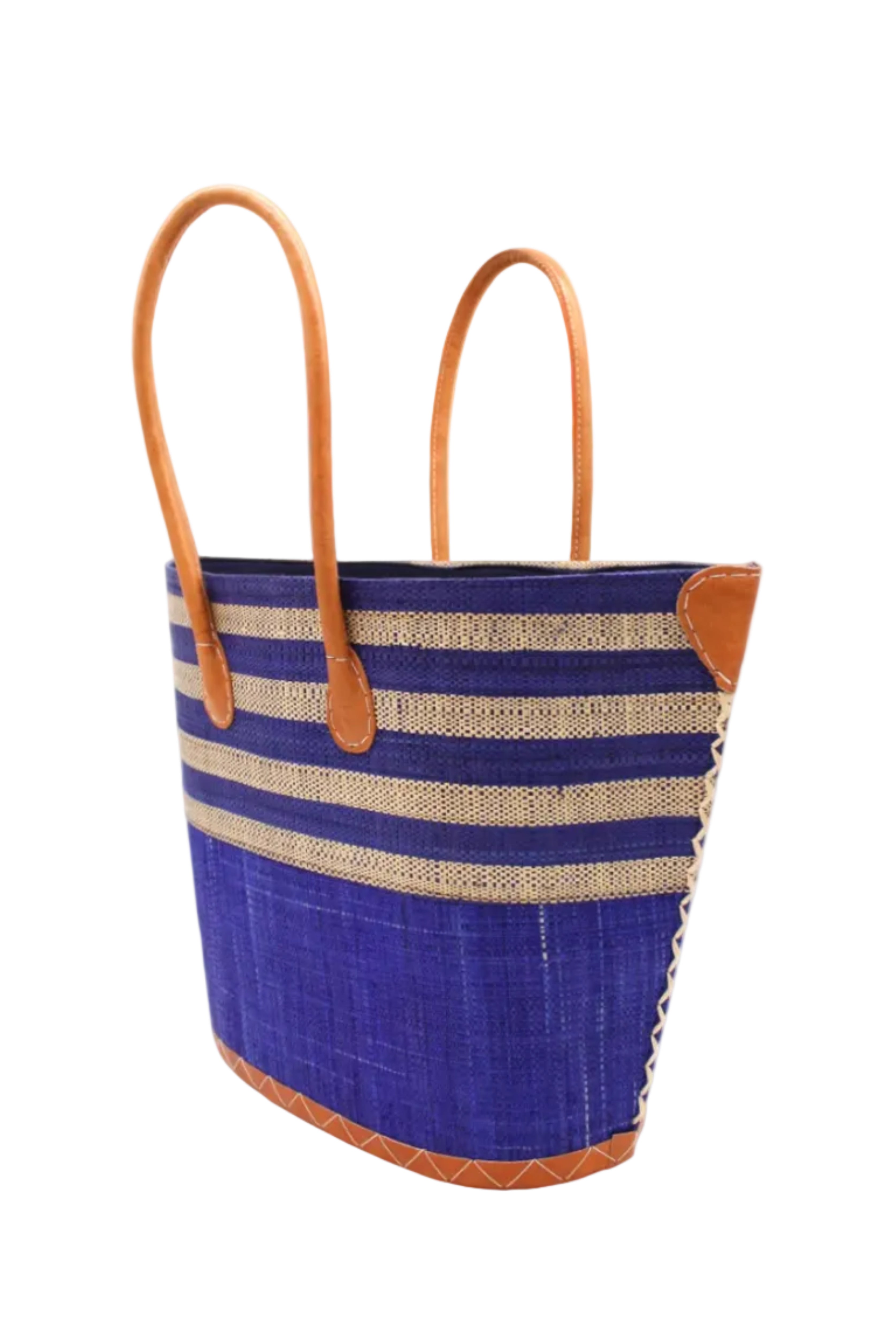 Side view Santa Cruz Dusk & Natural Two Tone Wide Stripe Small Straw Tote Bag handmade loomed natural raffia palm fiber in a two tone color block pattern of solid dusk navy/dark/blue on the bottom half of the bag and two tone even width horizontal stripes of dusk and natural straw color on the top half of the bag with leather handles and details beach bag handbag purse - Shebobo
