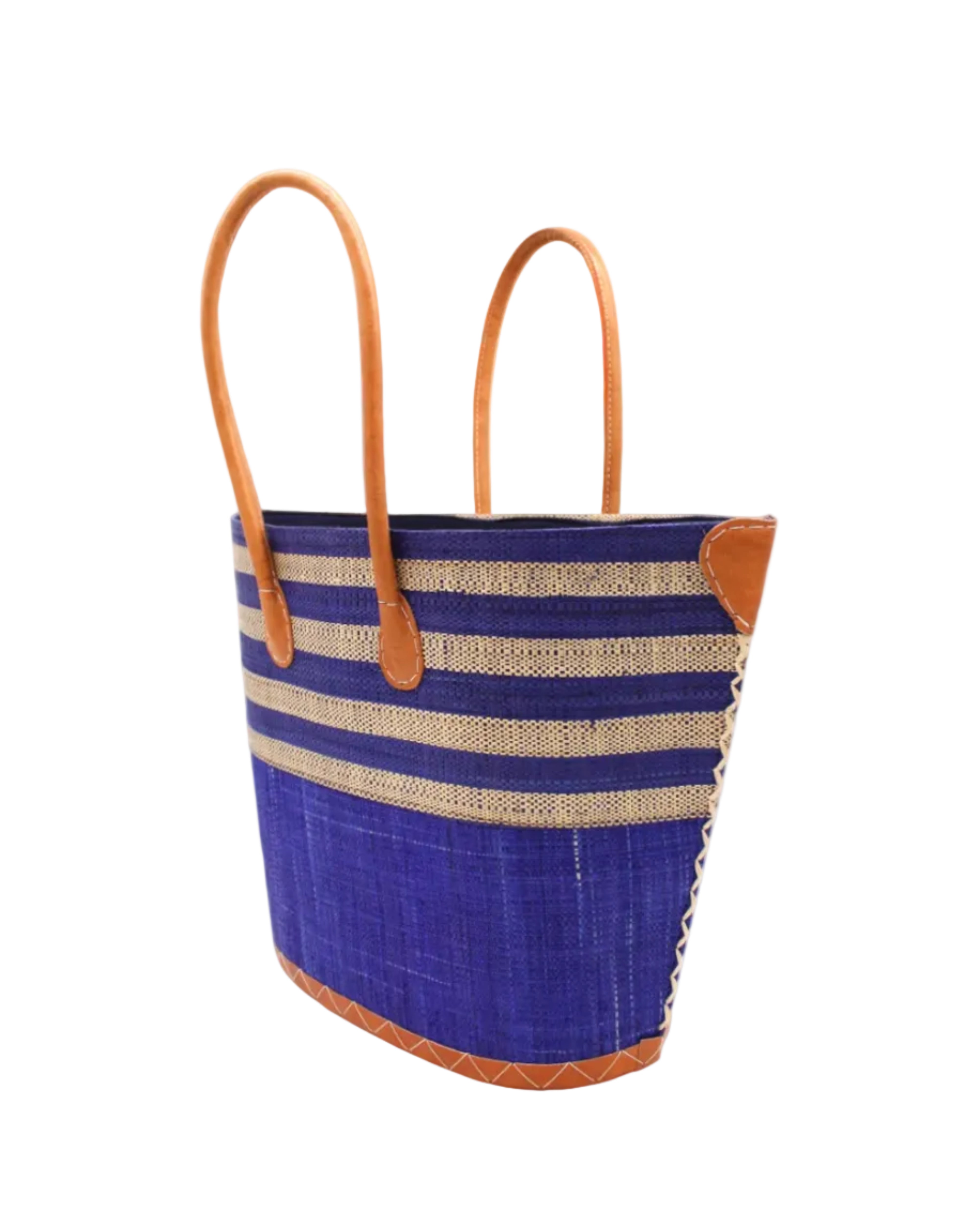 Side view Santa Cruz Dusk & Natural Two Tone Wide Stripe Small Straw Tote Bag handmade loomed natural raffia palm fiber in a two tone color block pattern of solid dusk navy/dark/blue on the bottom half of the bag and two tone even width horizontal stripes of dusk and natural straw color on the top half of the bag with leather handles and details beach bag handbag purse - Shebobo