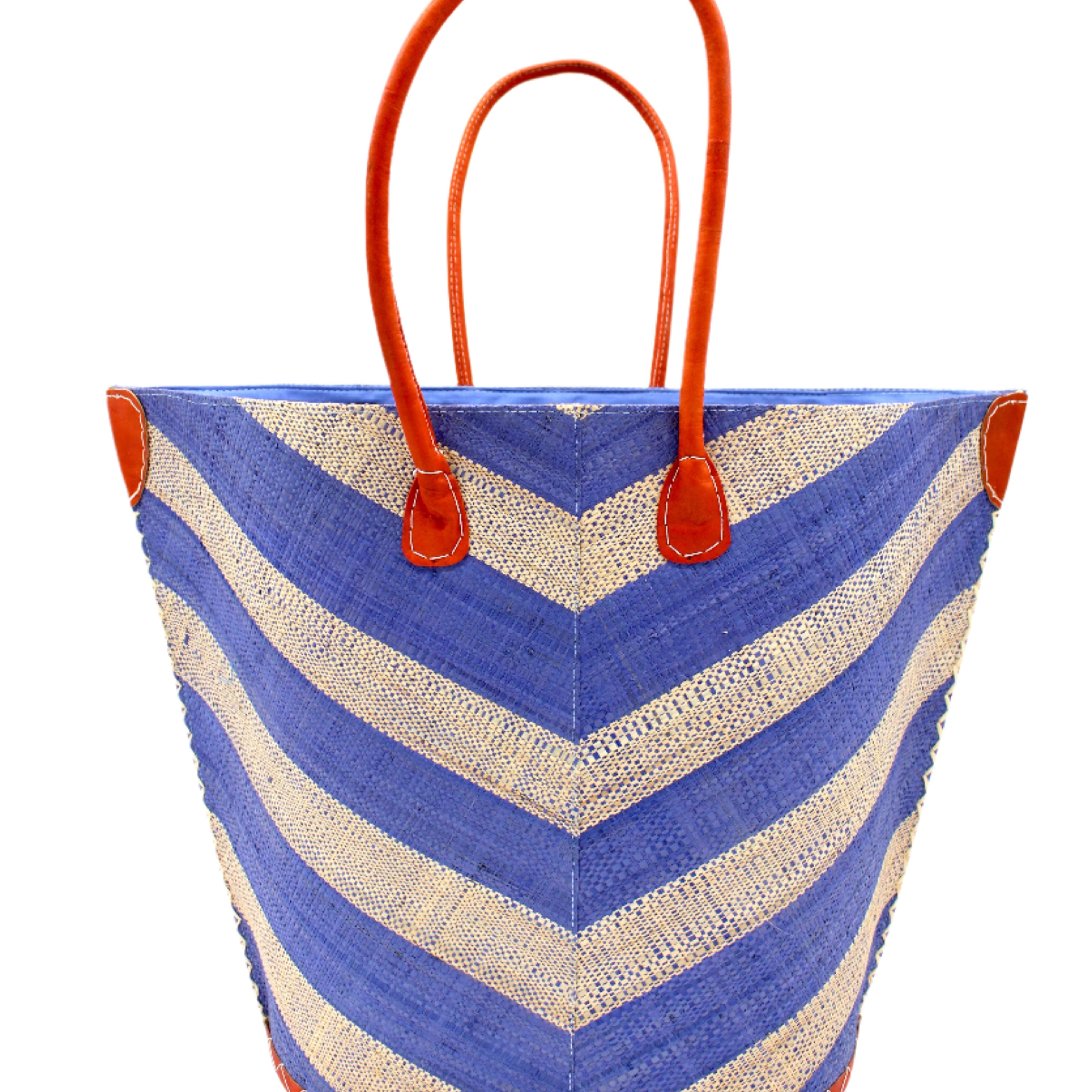 Santa Cruz Wide Stripe Chevron Large Straw Tote Bag handmade loomed raffia palm fiber in a two tone diagonal even width bands of color in a wide stripe chevron pattern of light denim/retro blue and natural straw color on the front and a matching solid hue on the back with leather accents and handles large shoulder bag - Shebobo