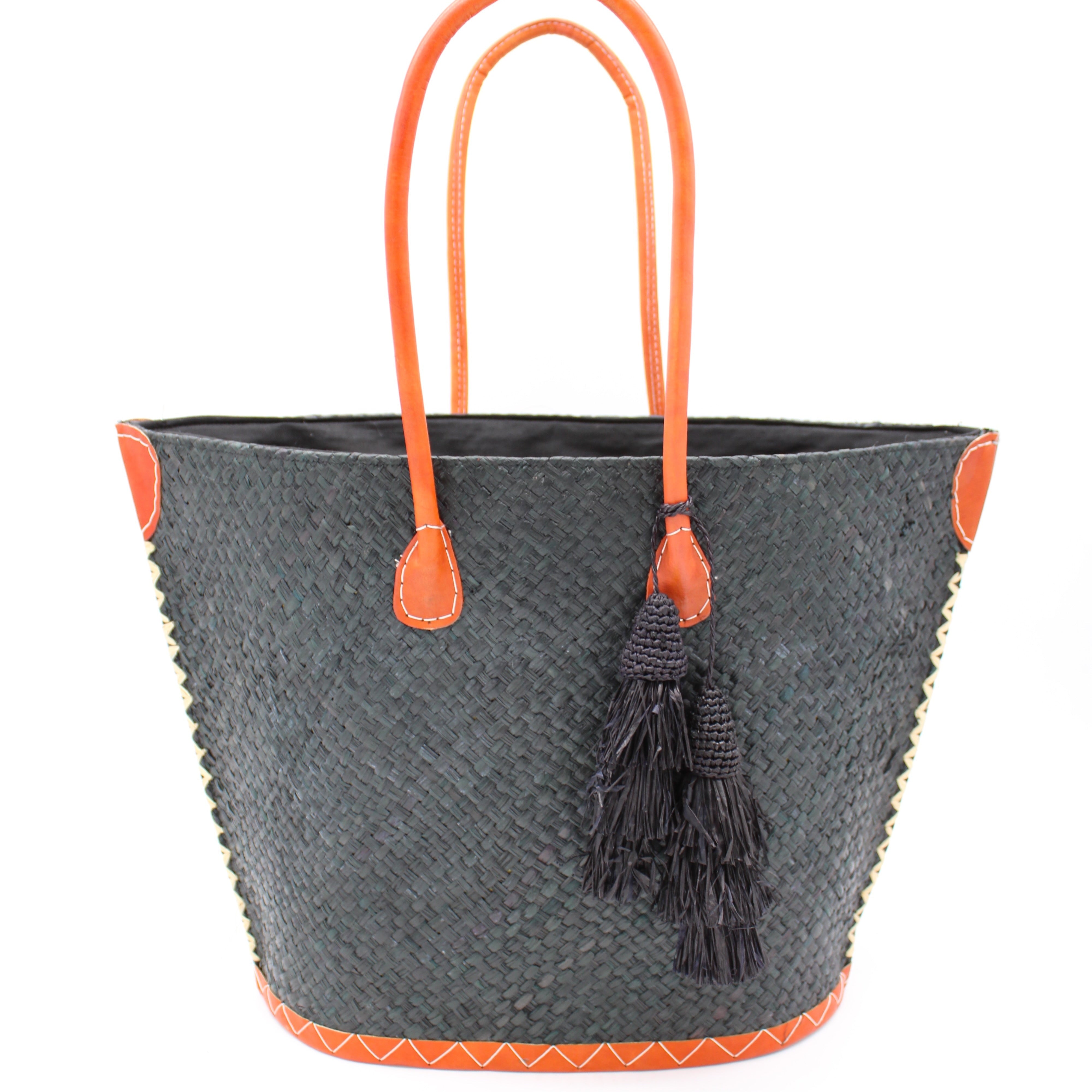 Santa Ynez Woven Small Straw Tote Bag with Tassel Charm Embellishment handmade woven raffia palm fiber in a solid hue of black with matching tassel tie charm embellishment and leather handles beach bag - Shebobo
