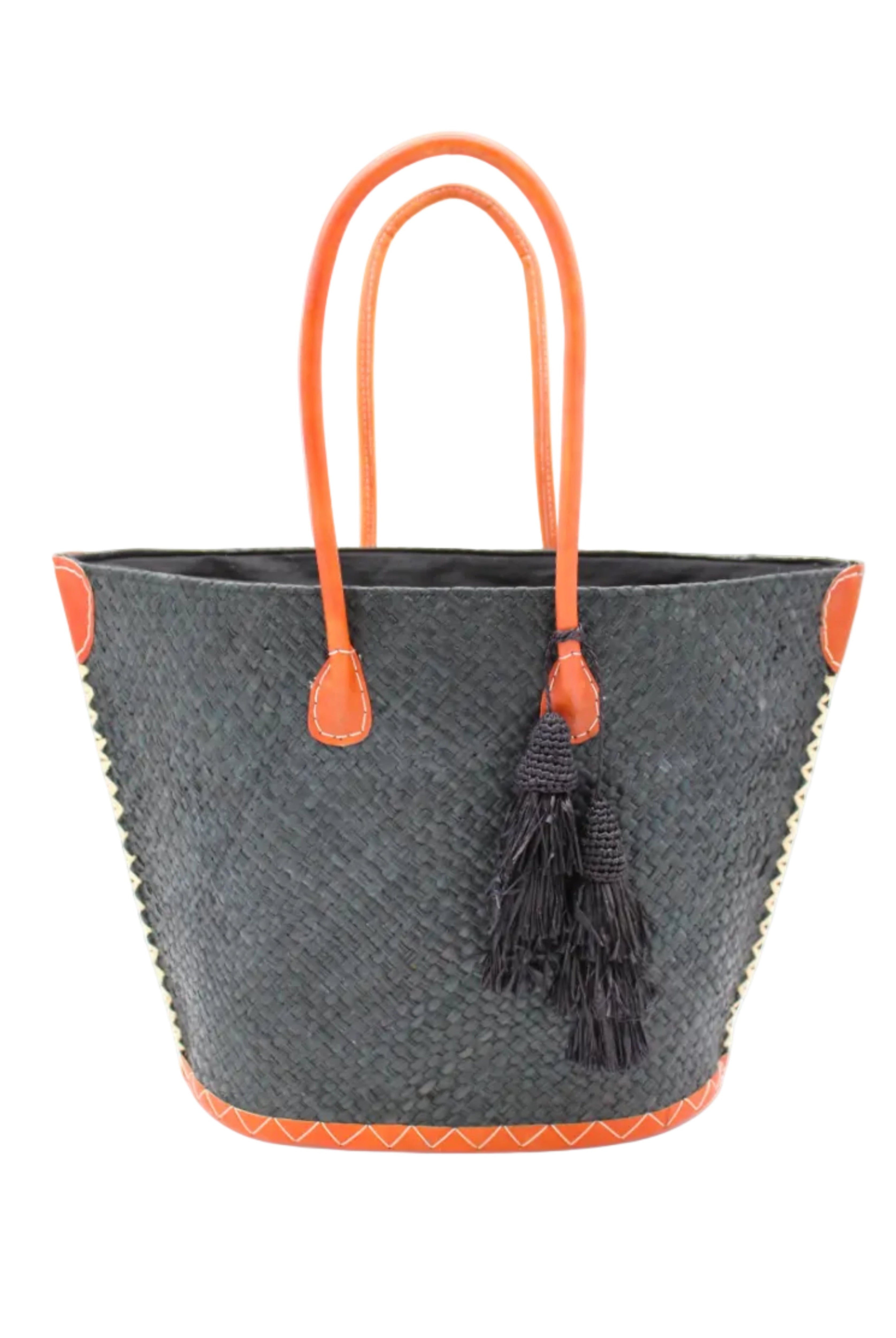 Santa Ynez Woven Small Straw Tote Bag with Tassel Charm Embellishment handmade woven raffia palm fiber in a solid hue of black with matching tassel tie charm embellishment and leather handles beach bag - Shebobo