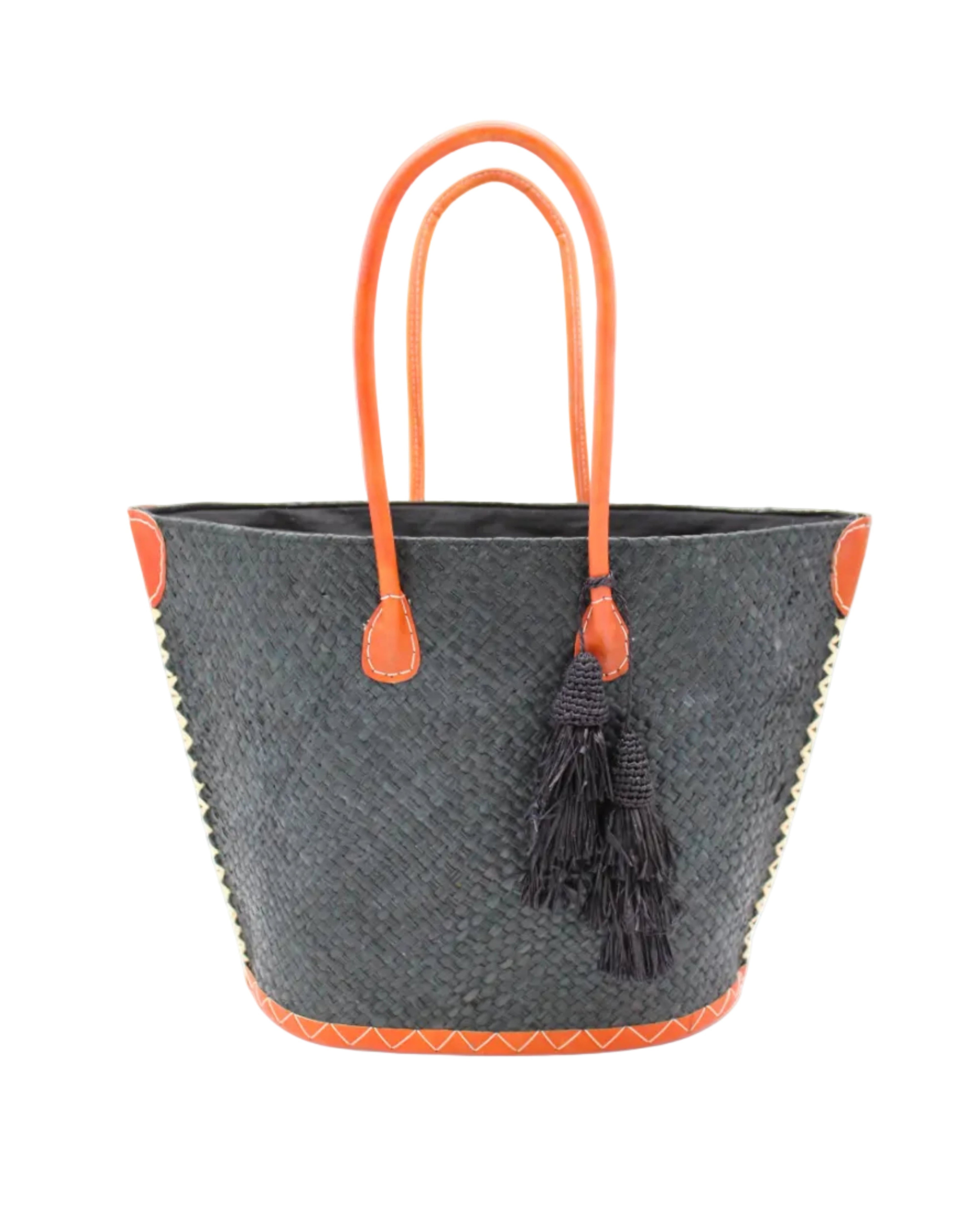 Santa Ynez Woven Small Straw Tote Bag with Tassel Charm Embellishment handmade woven raffia palm fiber in a solid hue of black with matching tassel tie charm embellishment and leather handles beach bag - Shebobo