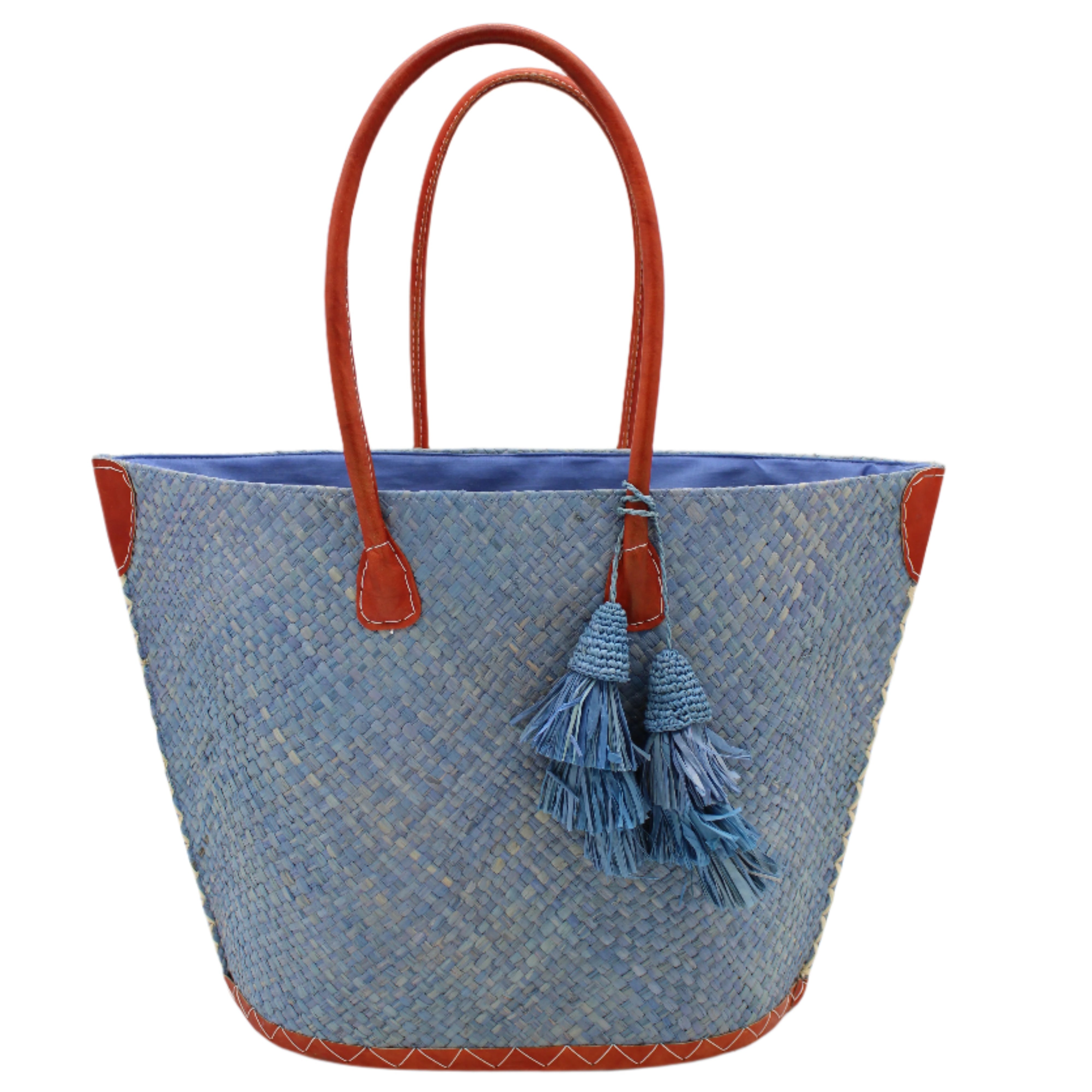Santa Ynez Woven Small Straw Tote Bag with Tassel Charm Embellishment handmade woven raffia palm fiber in a solid hue of denim retro/light/blue with matching tassel tie charm embellishment and leather handles beach bag - Shebobo