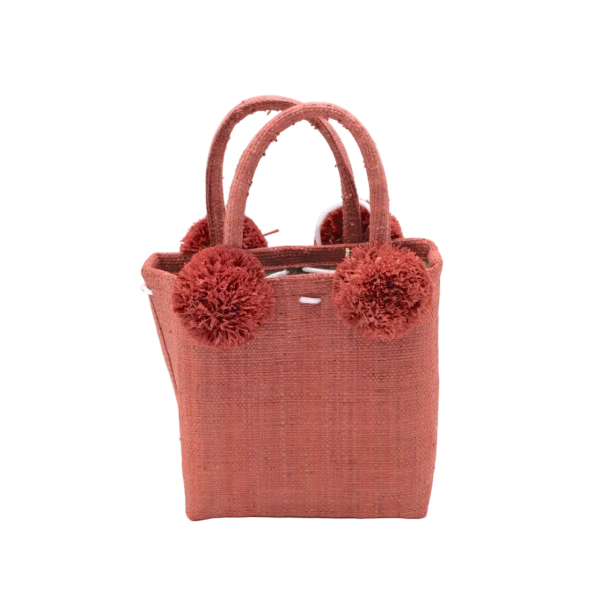 Schooner Straw Mini Bag with Pompom Accent handmade loomed natural raffia palm fiber in a solid hue of Blush orange/pink with four matching raffia pompom embellishments at the base of each handle attachment tiny purse extra small handbag - Shebobo