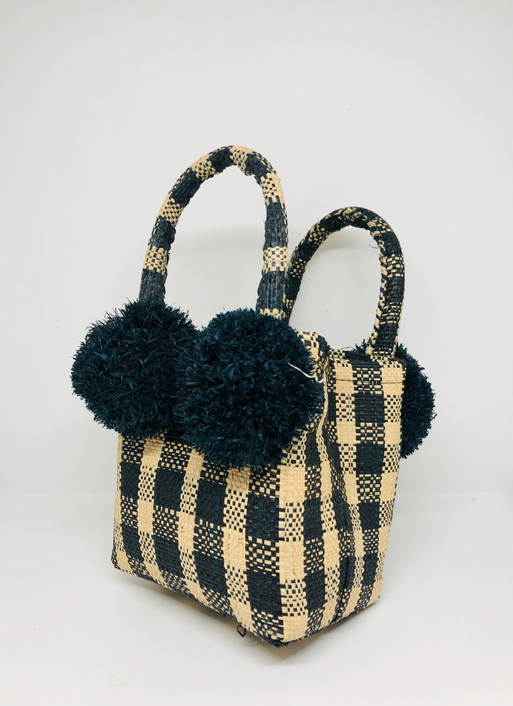 Schooner Black Gingham Straw Mini Bag with Pompom Accent handmade loomed natural raffia palm fiber in two tones of black and natural straw color small gingham plaid pattern with four black raffia pompom embellishments at the base of each handle attachment tiny purse extra small handbag - Shebobo