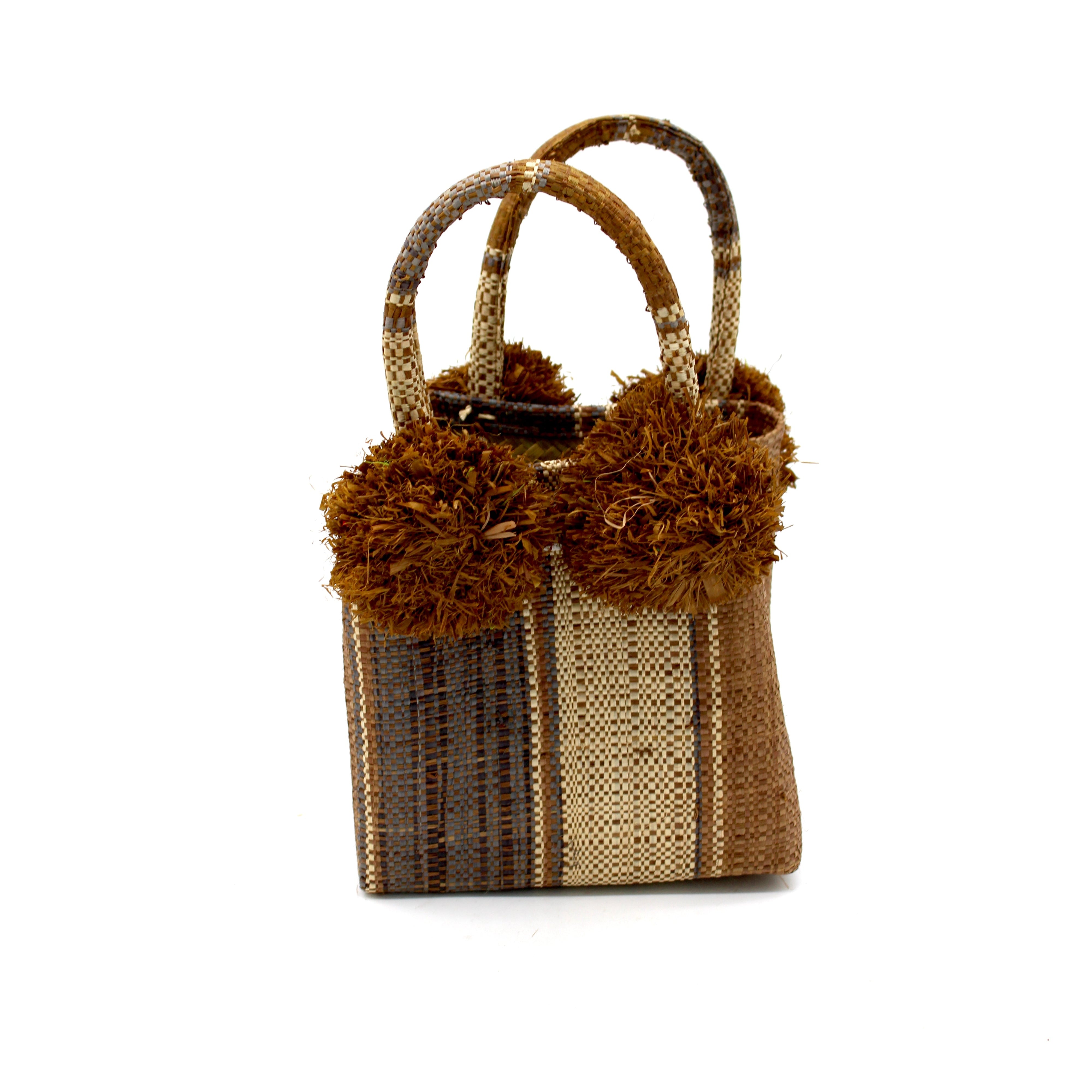 Schooner Cinnamon Swirl Straw Mini Bag with Pompom Accent handmade loomed natural raffia palm fiber in multi width vertical multicolor stripe pattern of cinnamon/tobacco/brown, grey, and natural straw color with four matching raffia pompom embellishments at the base of each handle attachment tiny purse extra small handbag - Shebobo