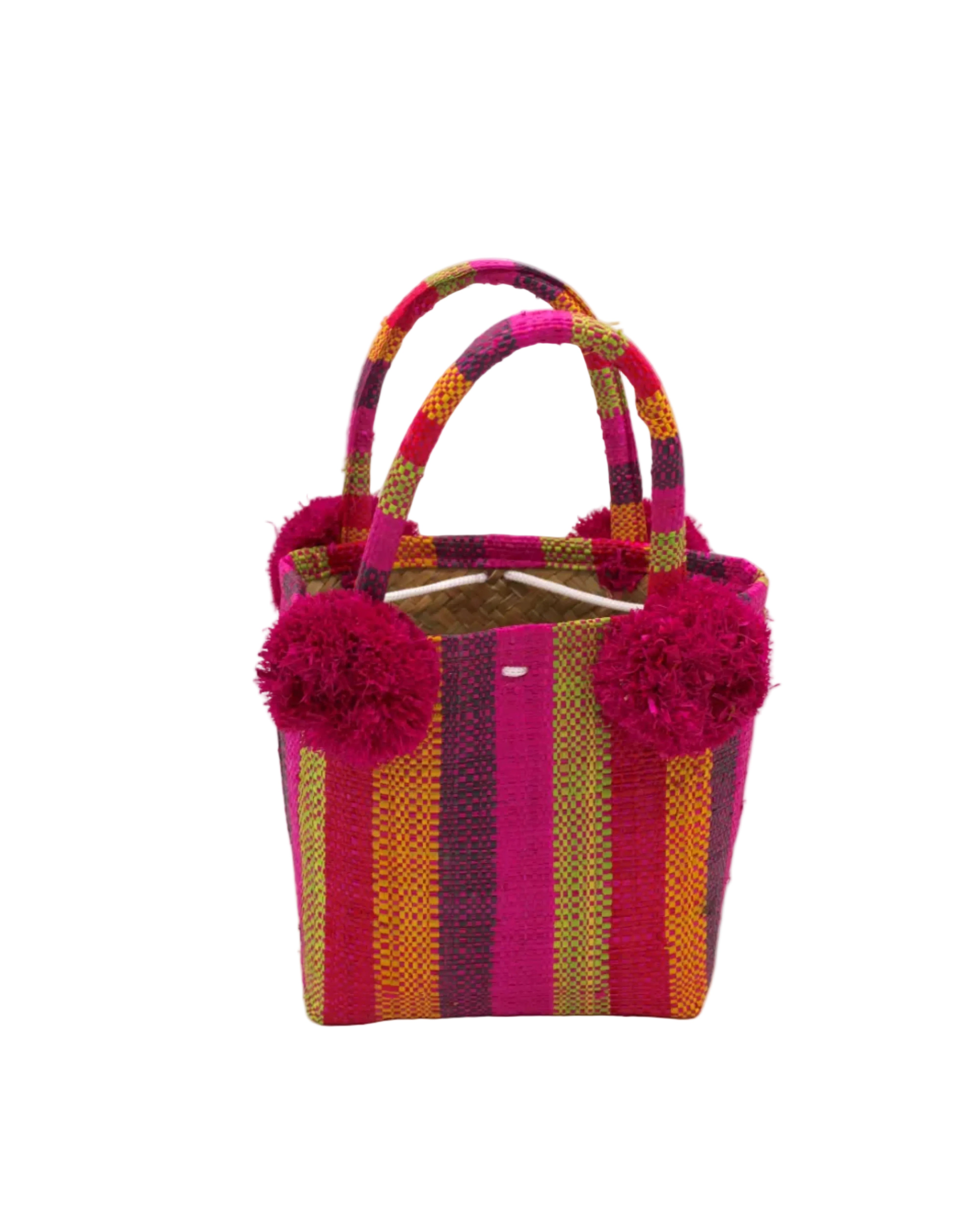 Schooner Fuchsia Stripe Straw Mini Bag with Pompom Accent handmade loomed natural raffia palm fiber in multi width vertical multicolor stripe pattern of fuchsia hot/bright/barbie pink, midori lime/green, saffron orange/yellow, red, black, etc. with four matching raffia pompom embellishments at the base of each handle attachment tiny purse extra small handbag - Shebobo