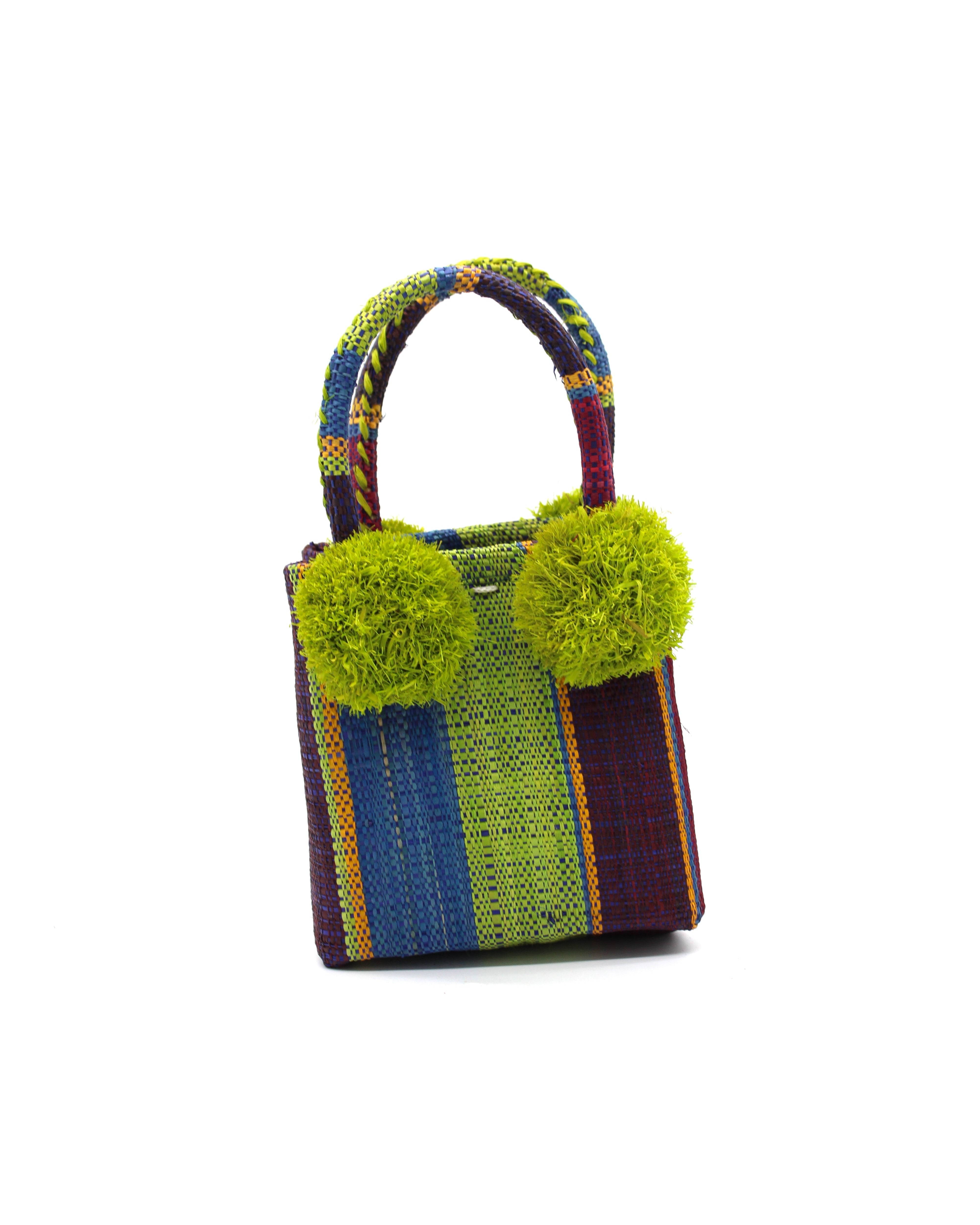 Schooner Midnight Swirl Straw Mini Bag with Pompom Accent handmade loomed natural raffia palm fiber in multi width vertical multicolor stripe pattern of bordeaux dark red/purple, orange, blue, green, etc. with four matching raffia pompom embellishments at the base of each handle attachment tiny purse extra small handbag - Shebobo