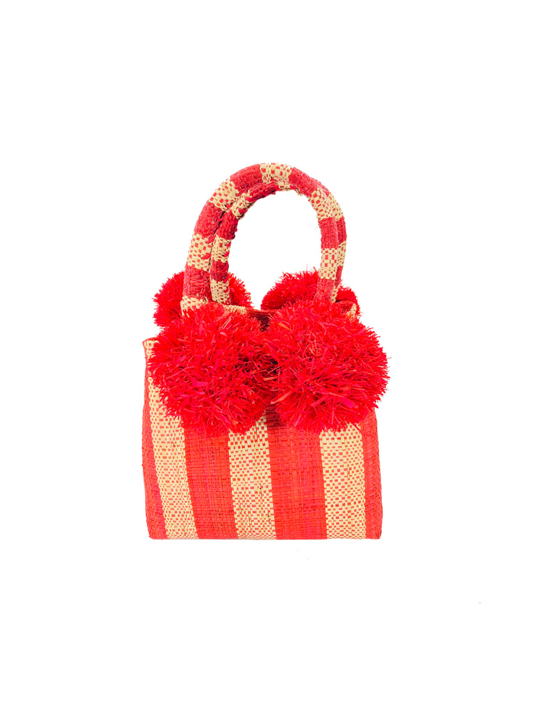 Schooner Red Stripe Straw Mini Bag with Pompom Accent handmade loomed natural raffia palm fiber in two tones of red and natural straw color vertical stripe pattern with four red raffia pompom embellishments at the base of each handle attachment tiny purse extra small handbag - Shebobo