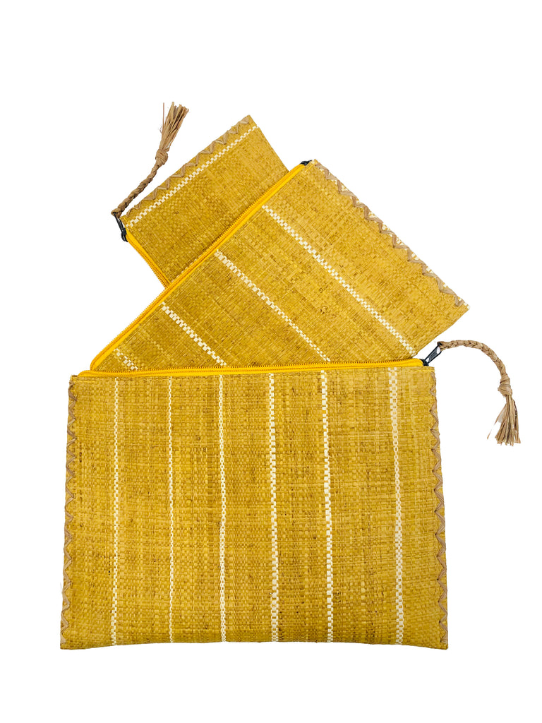 Set of 3 Saffron Nesting Zippered Straw Clutches Pinstripe Pattern handmade loomed raffia in wide vertical bands of saffron yellow with narrow bands of natural straw color with matching zipper and braided zipper pull with cross stitch edging in three sizes of small, medium, and large - Shebobo