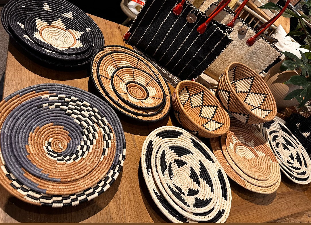 Assorted view Dakarai Raffia Straw Wall Decor Display Basket Trays: Set of 3 and Amara Raffia Straw Decor Display Basket Bowls: Set of 3 - handmade crochet natural raffia palm fiber in a concentric circle woven into display trays with incorporated patterns - Shebobo