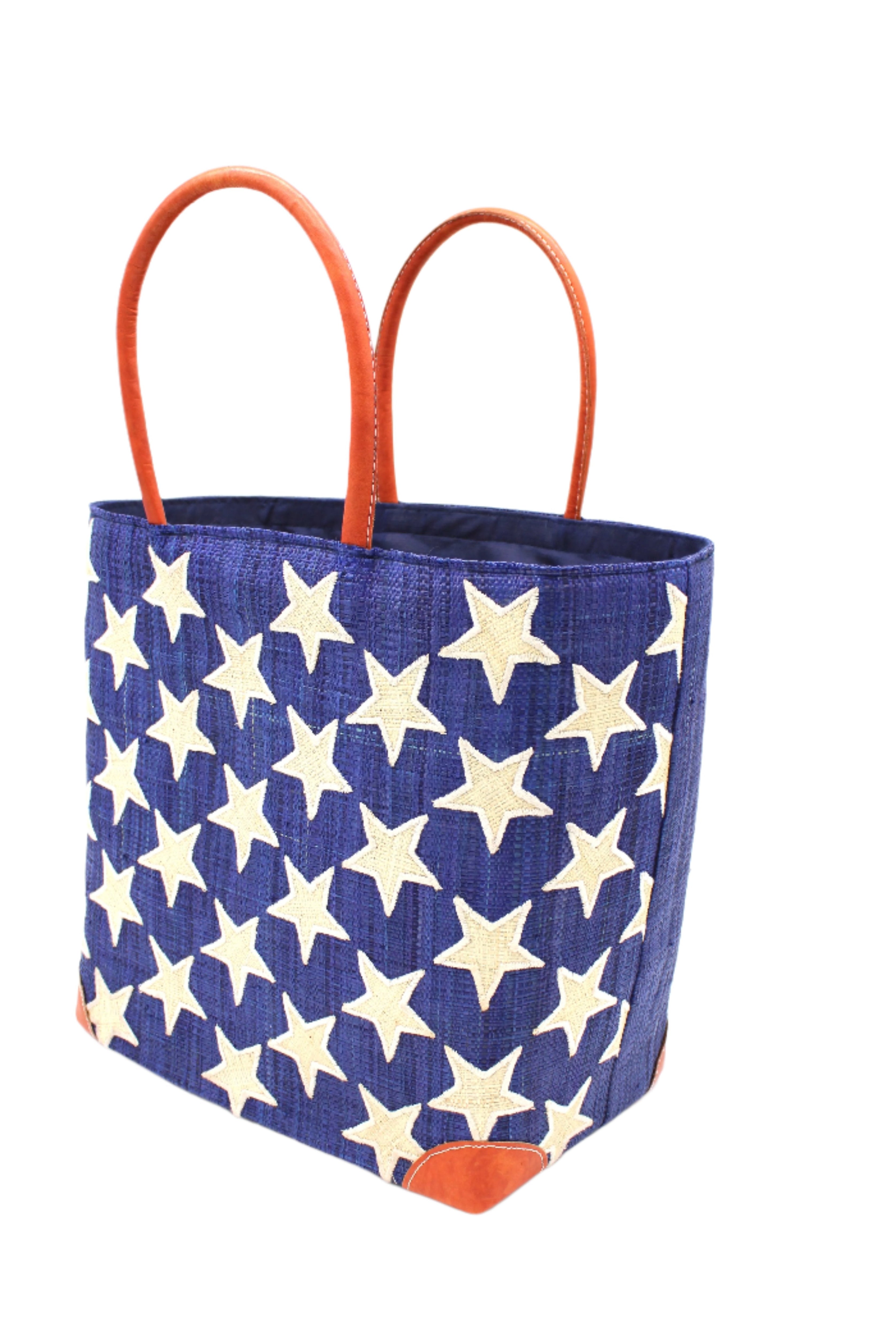 Side View Stars Straw Basket Bag handmade loomed raffia palm fiber in a solid hue of Dusk navy/dark/blue with natural straw color loomed stars stitched on in a tight diagonal pattern with leather handles Patriotic Americana Shoulder Bag Beach Bag - Shebobo