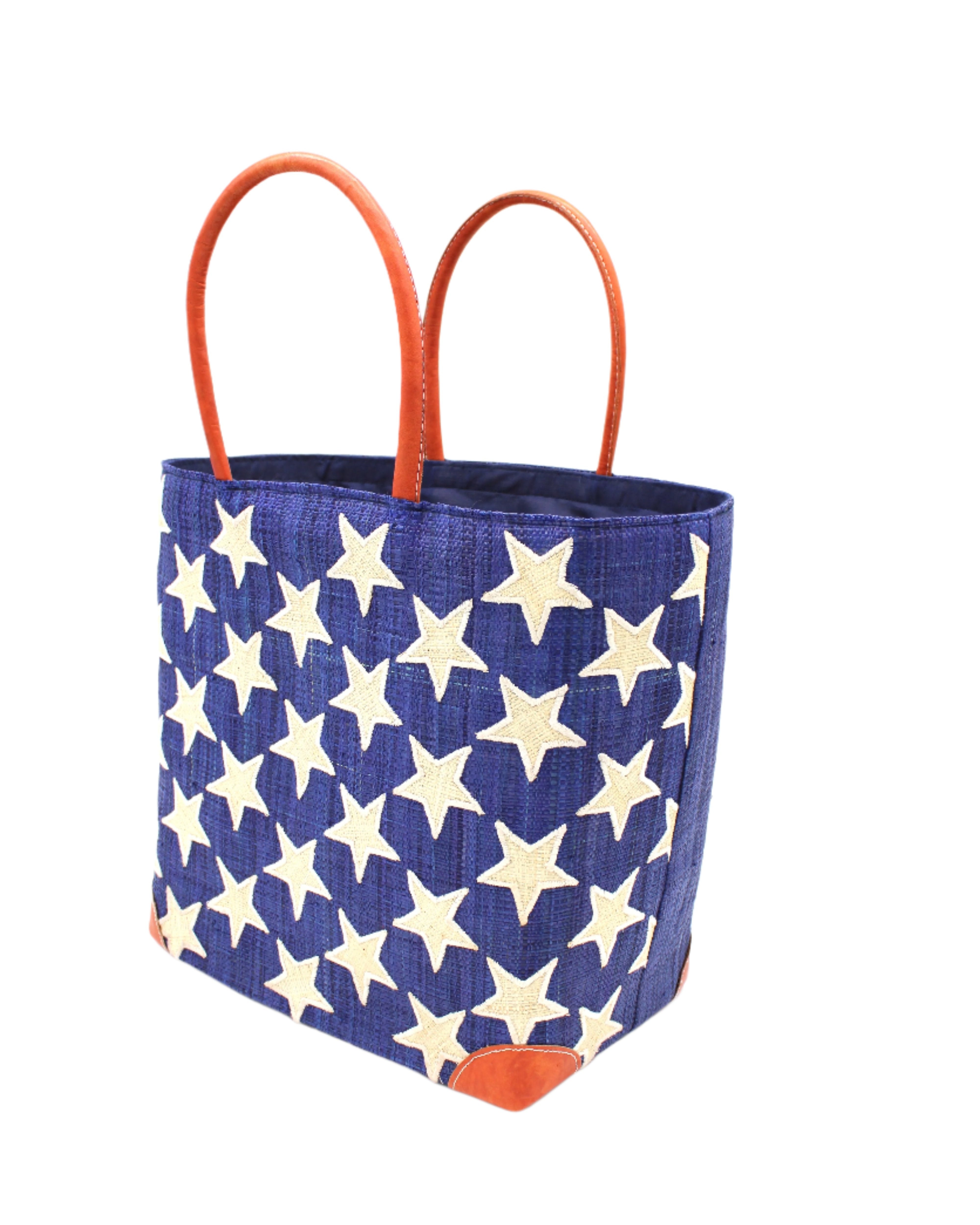 Side View Stars Straw Basket Bag handmade loomed raffia palm fiber in a solid hue of Dusk navy/dark/blue with natural straw color loomed stars stitched on in a tight diagonal pattern with leather handles Patriotic Americana Shoulder Bag Beach Bag - Shebobo