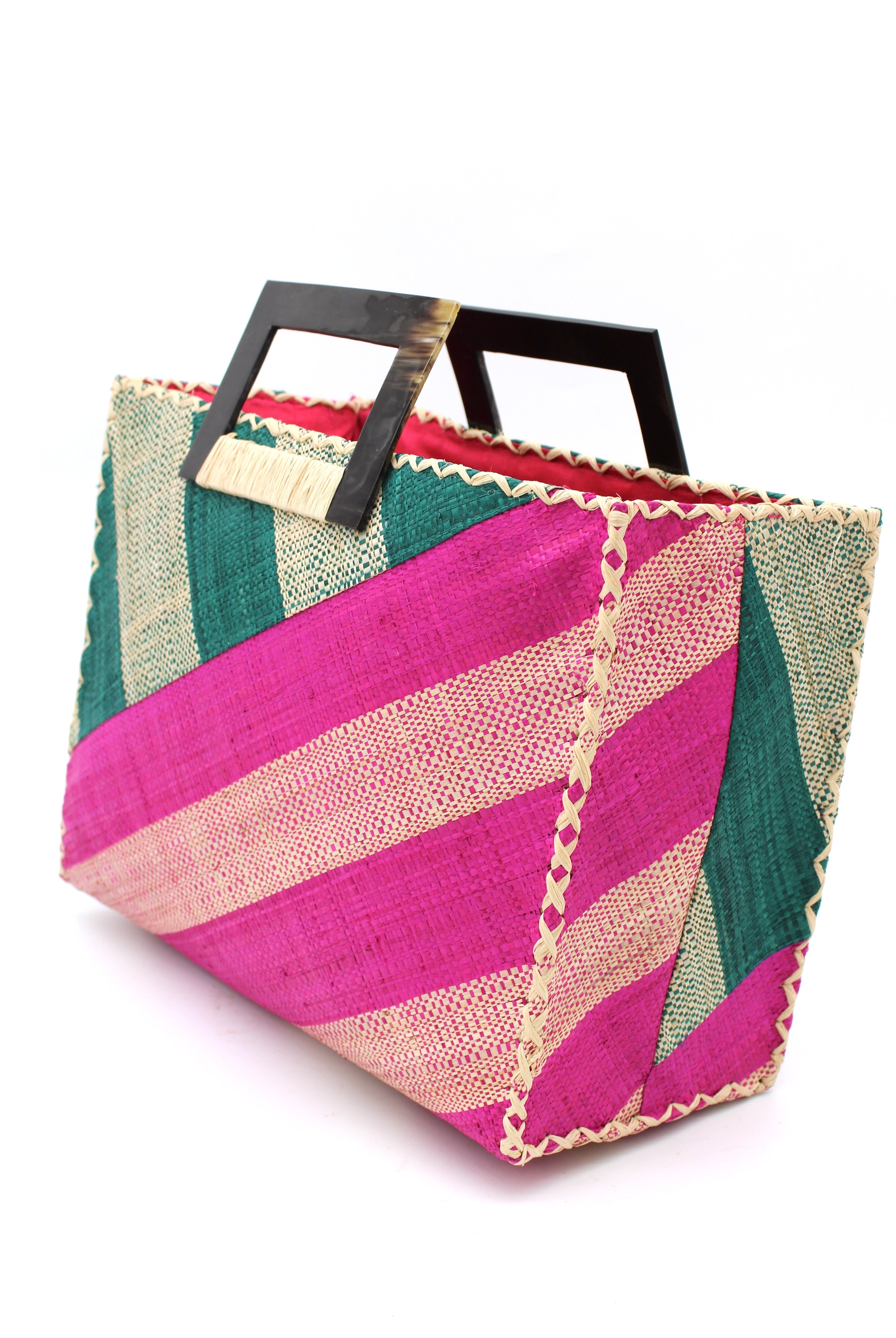 Side View Stevie Double Wide Stripe Fuchsia & Teal Square Straw Handbag with Horn Handles handmade loomed raffia palm fiber in even width wide stripe pattern of Fuchsia hot/bright/barbie/pink and natural straw color oriented on the diagonal of three quarters of the bag with matching stripe pattern of Teal dark/blue/green and natural diagonally on the top left corner quarter shoulder bag handbag - Shebobo