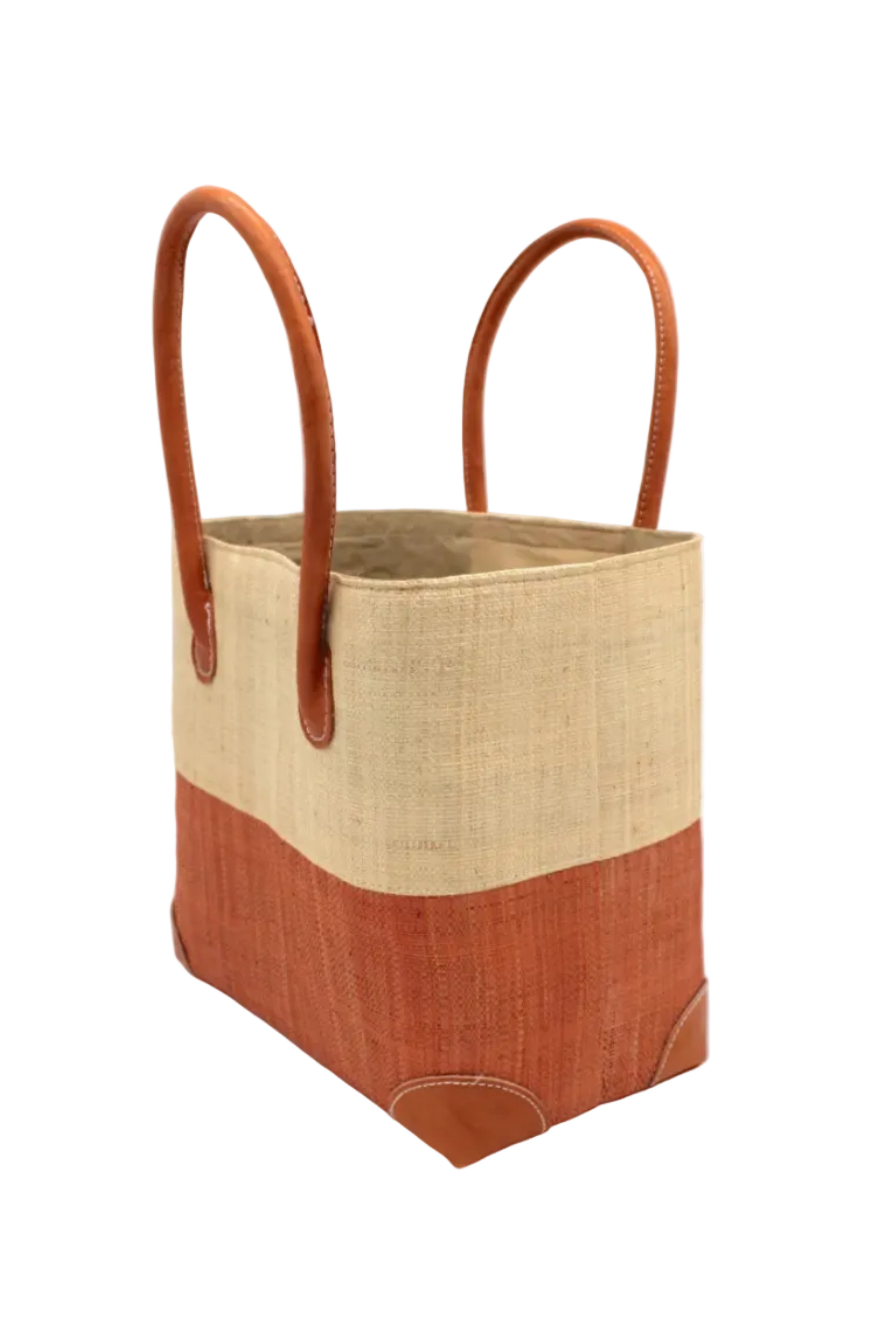 Side view Trinidad Natural and Blush Two Tone Straw Basket Bag handmade loomed raffia palm fiber in a two tone color block pattern with blush light/orange/pink on the bottom half and natural straw color on the top half of the bag with leather handles and accents beach bag tote purse - Shebobo