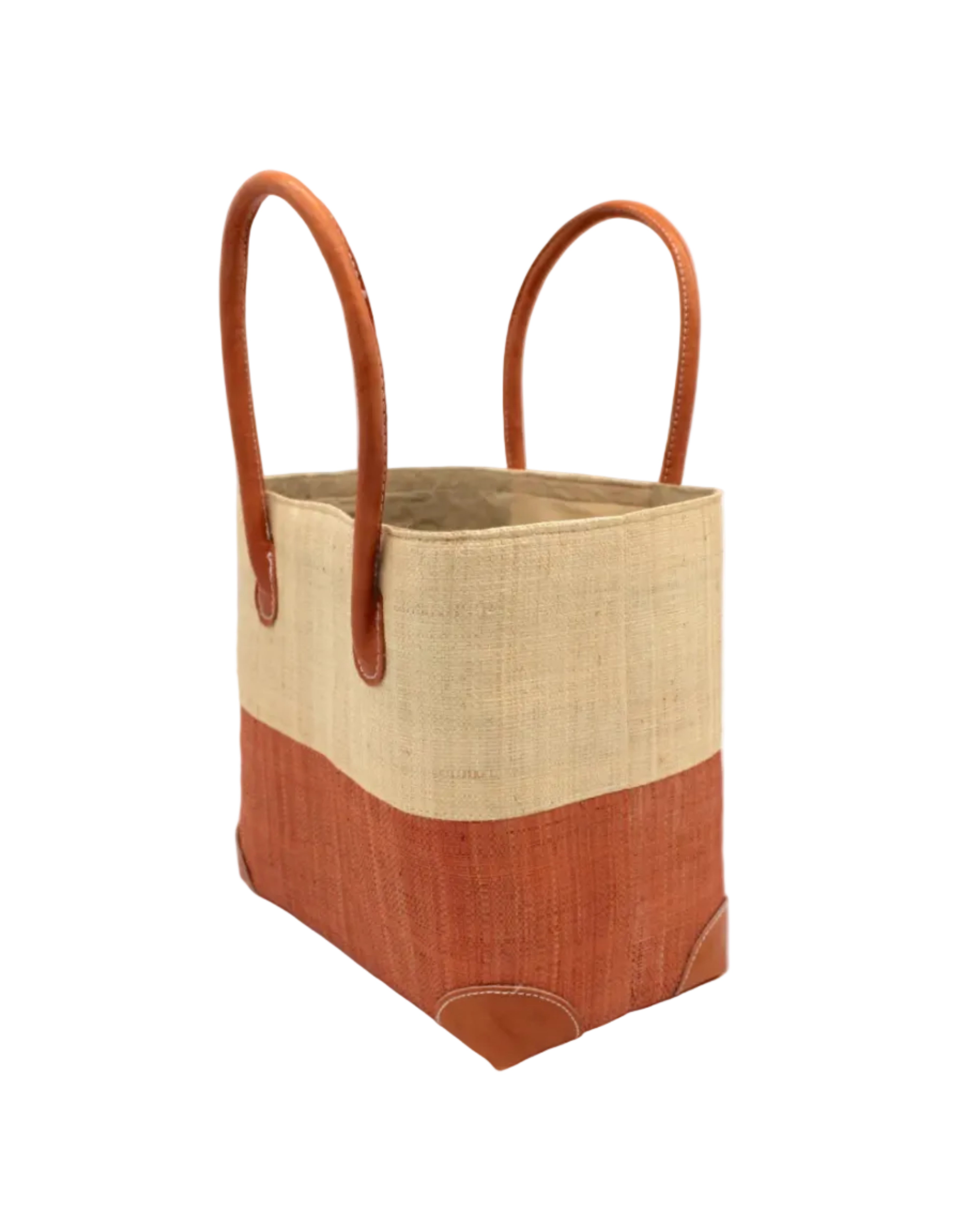 Side view Trinidad Natural and Blush Two Tone Straw Basket Bag handmade loomed raffia palm fiber in a two tone color block pattern with blush light/orange/pink on the bottom half and natural straw color on the top half of the bag with leather handles and accents beach bag tote purse - Shebobo