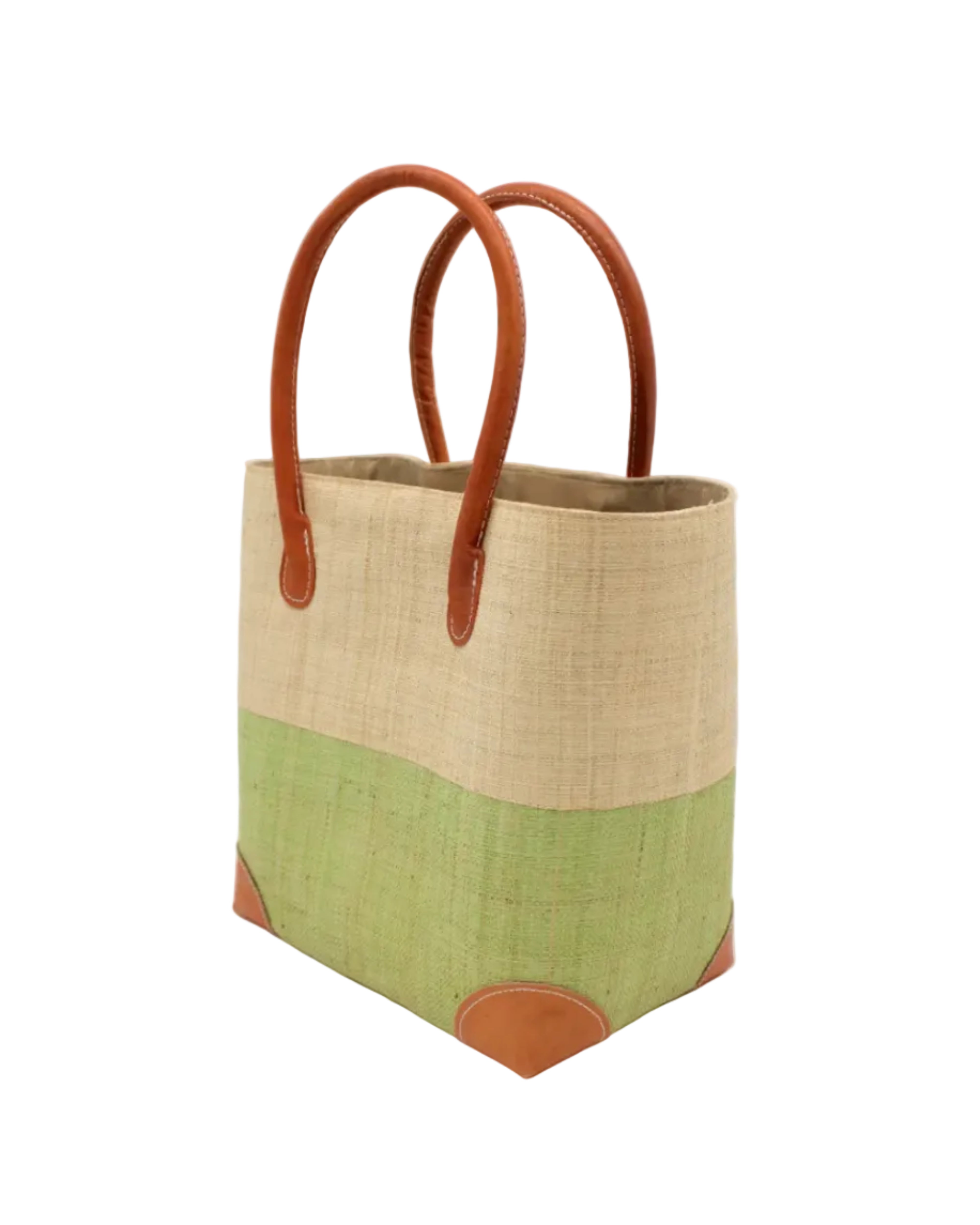 Side view Trinidad Natural and Matcha Two Tone Straw Basket Bag handmade loomed raffia palm fiber in a two tone color block pattern with matcha meadow/light/green on the bottom half and natural straw color on the top half of the bag with leather handles and accents beach bag tote purse - Shebobo
