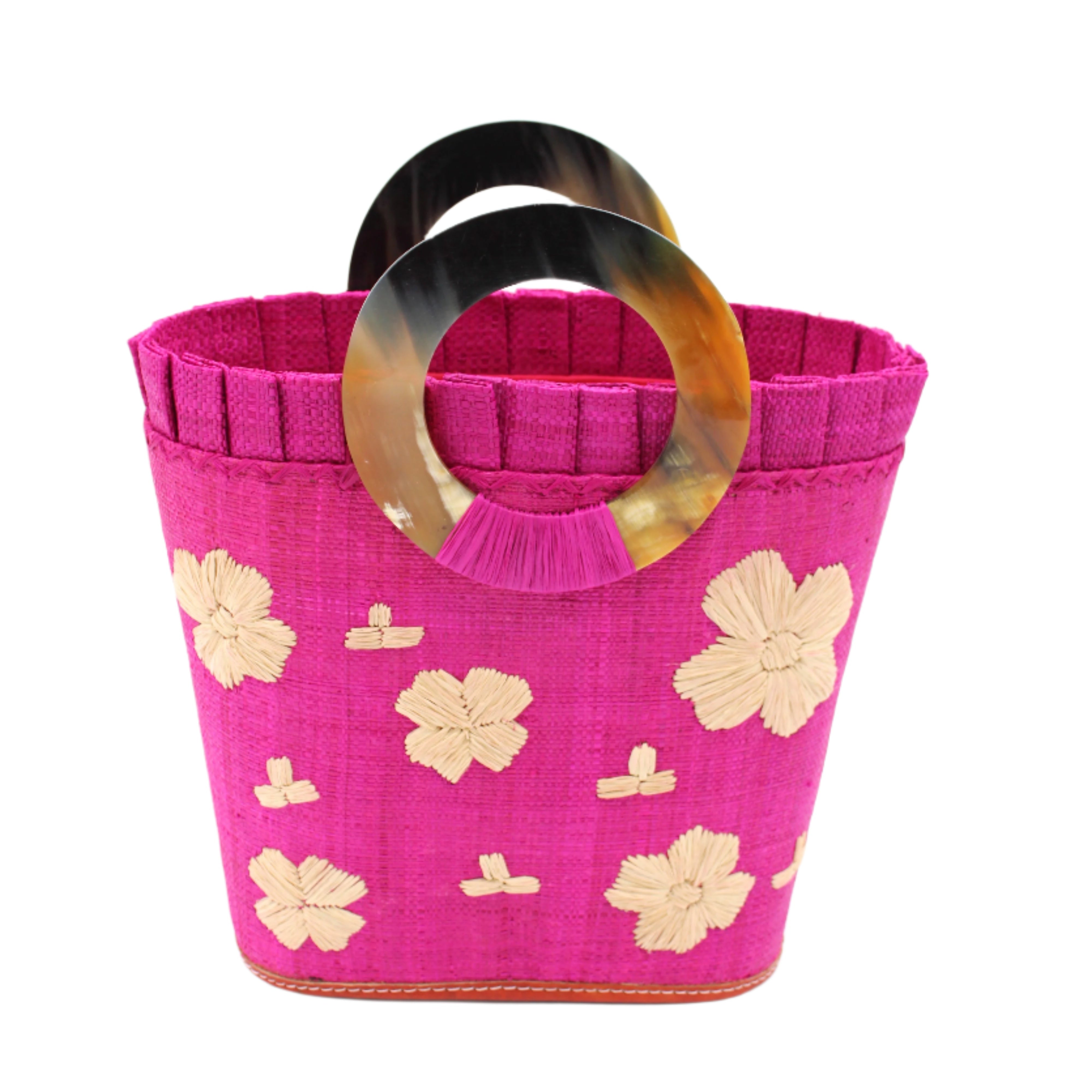 Tulum Straw Bucket Bag with Flower Embroidery and Horn Handle Fuchsia Purse with Ruffle Edge handmade loomed raffia palm fiber in a solid hue of fuchsia hot/bright/barbie/pink with natural straw color hand embroidered floral pattern with multiple sized flowers and raffia ruffle on the opening handbag - Shebobo
