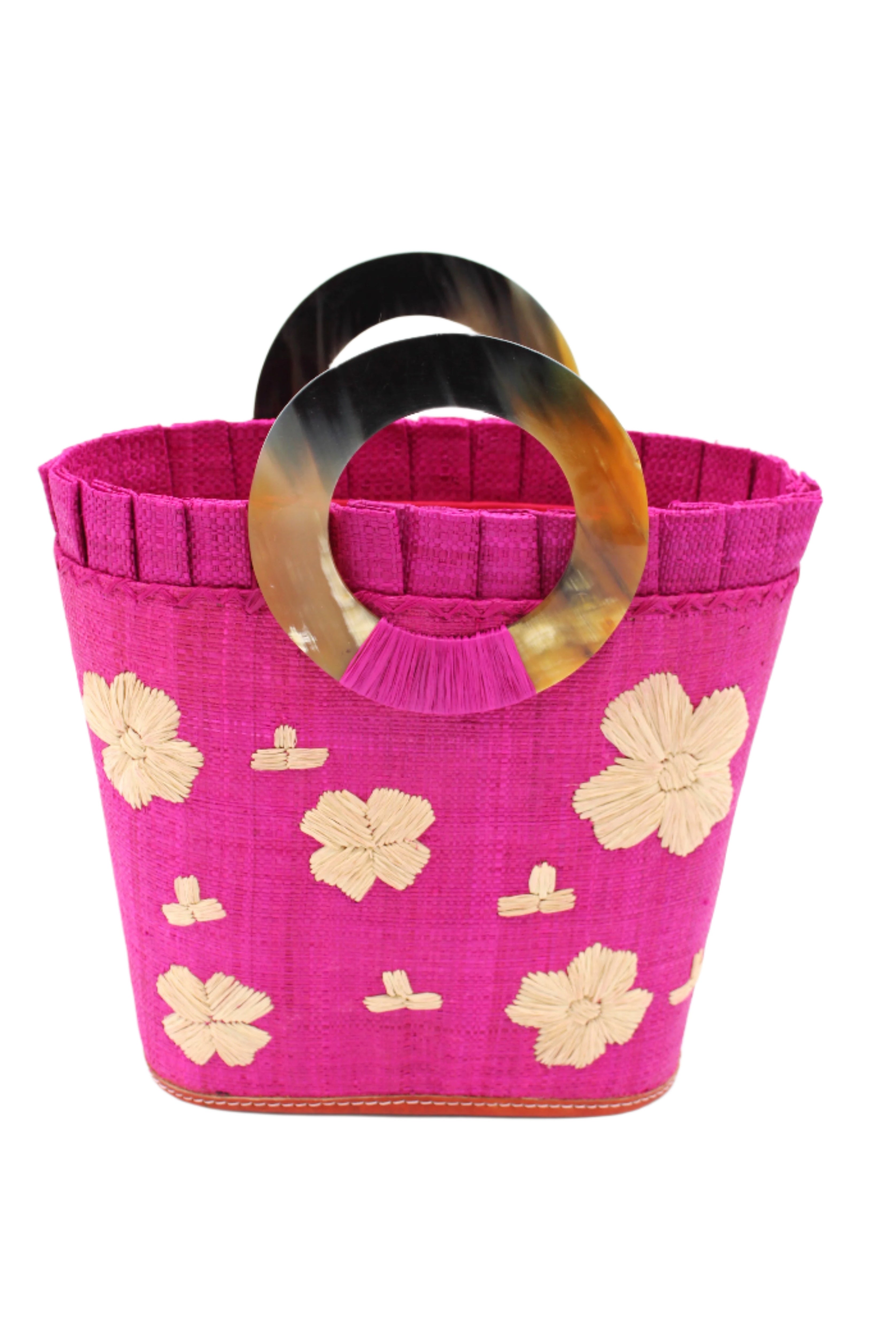 Tulum Straw Bucket Bag with Flower Embroidery and Horn Handle Fuchsia Purse with Ruffle Edge handmade loomed raffia palm fiber in a solid hue of fuchsia hot/bright/barbie/pink with natural straw color hand embroidered floral pattern with multiple sized flowers and raffia ruffle on the opening handbag - Shebobo