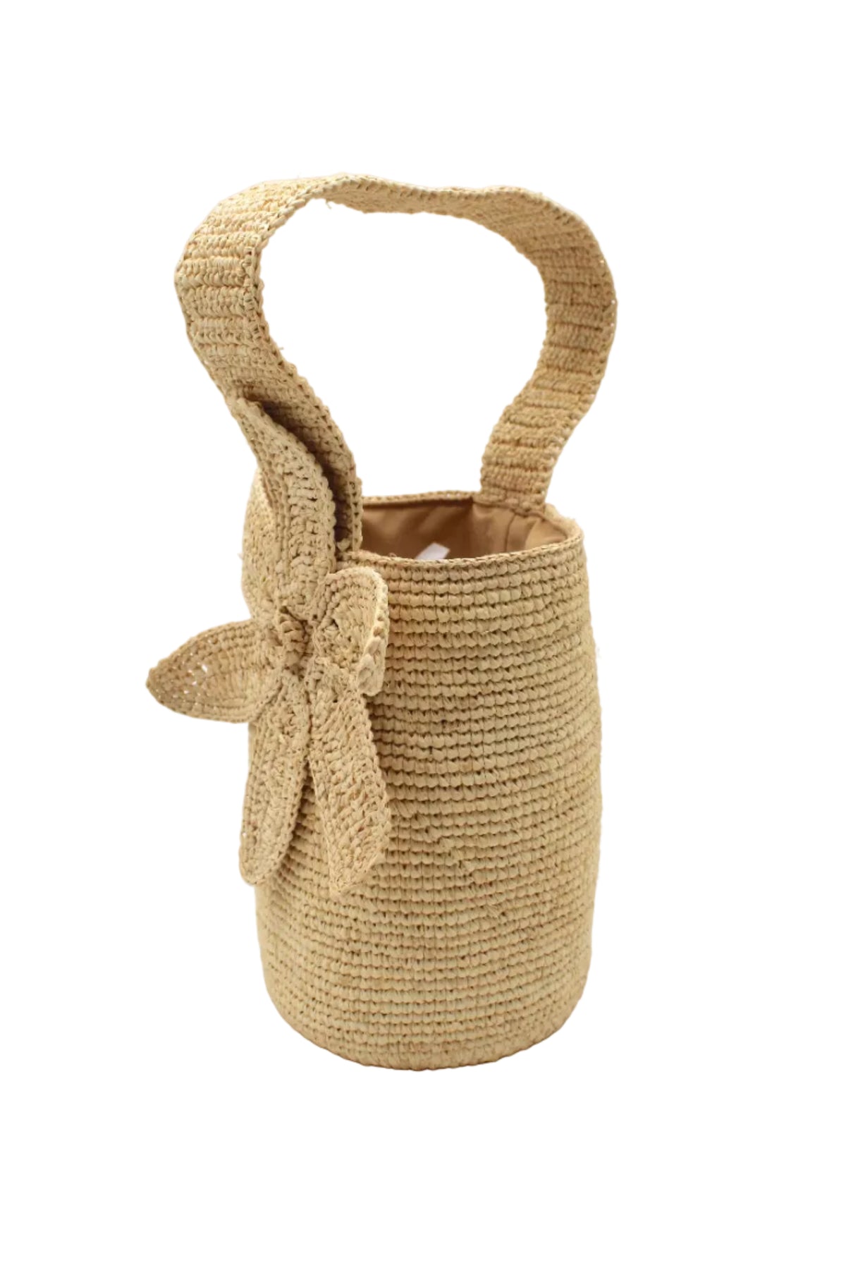Side view Valencia Mini Crochet Petit Straw Basket Handbag with Flower Embellishment handmade natural raffia palm fiber in a solid hue of Natural straw color crochet in bands of horizontal link pattern texture with integrated strap handle and large flower embellishment - Shebobo