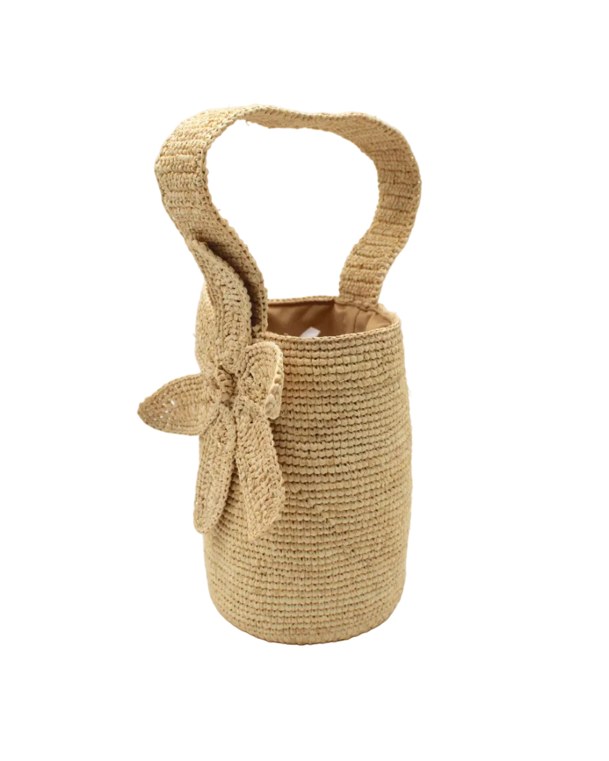 Side view Valencia Mini Crochet Petit Straw Basket Handbag with Flower Embellishment handmade natural raffia palm fiber in a solid hue of Natural straw color crochet in bands of horizontal link pattern texture with integrated strap handle and large flower embellishment - Shebobo