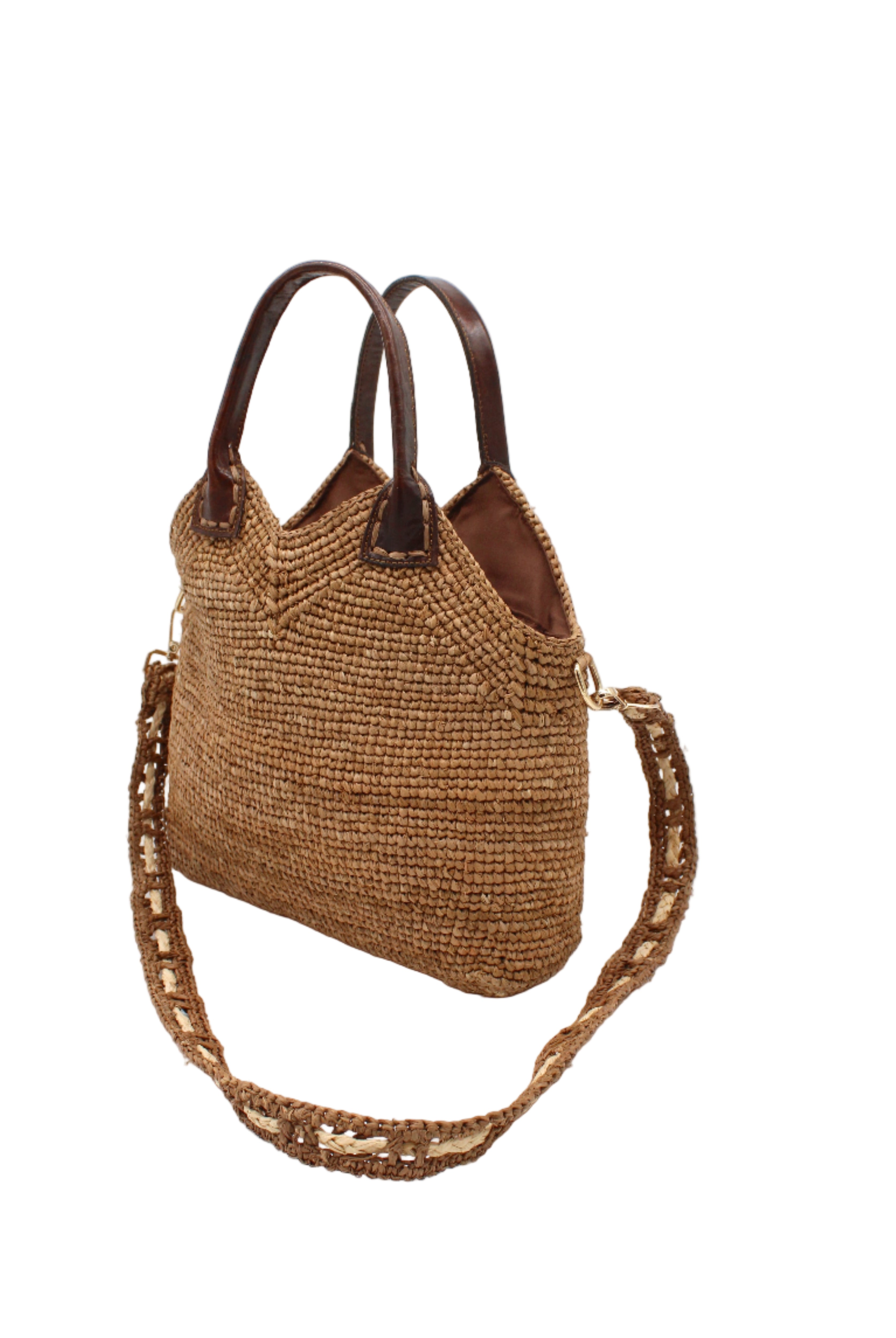 Side view Victoria Crochet Straw Handbag Convertible Crossbody Bag handmade crochet natural raffia palm fiber in a solid hue of cappuccino tea/light/brown in a subtle texture of horizontal link bands pattern across the bag and m shape around the top of the bag with dark brown leather handles and removable two tone natural and cappuccino tea/light/brown crossbody strap convertible purse - Shebobo