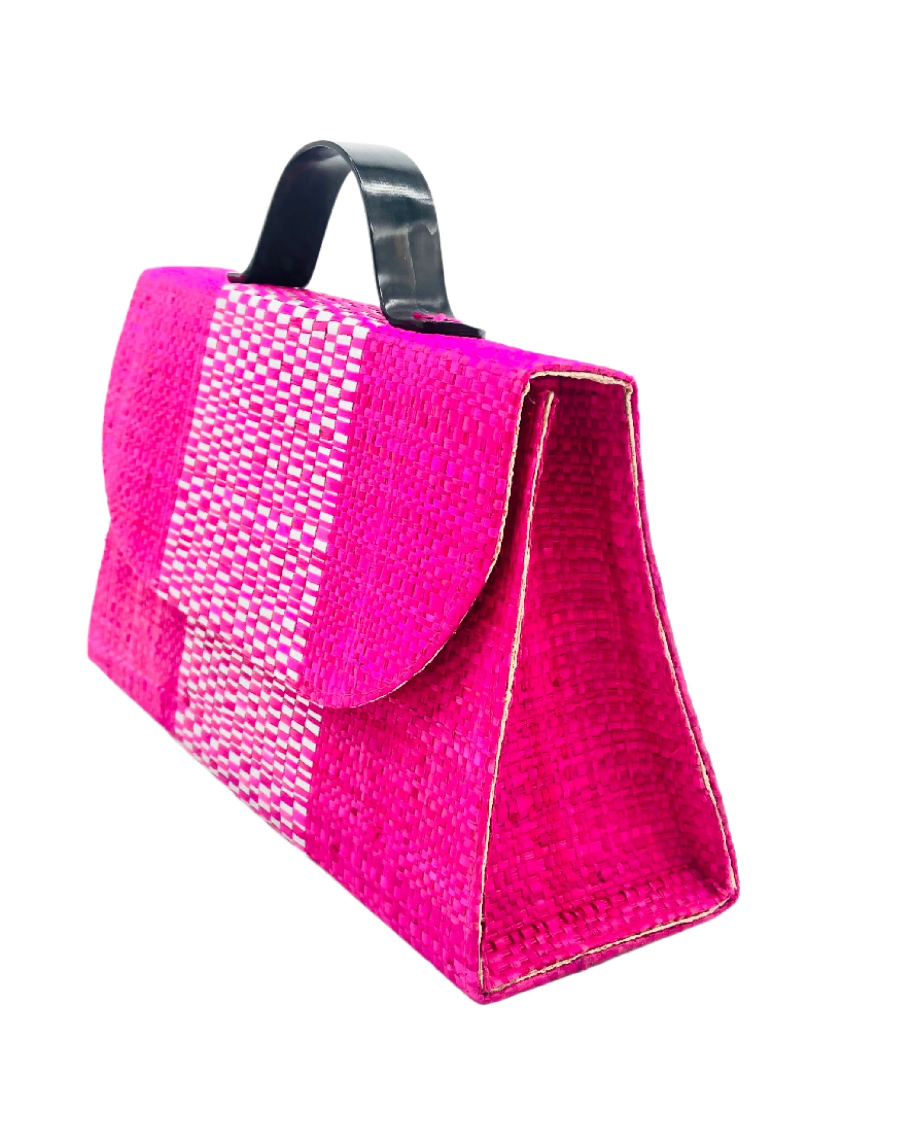 Side view Wynwood Fuchsia Straw Handbag with Metallic Detailing & Horn Handle handmade loomed raffia in fuchsia pink and silver metallic vegan leather in three vertical bands of color with the metallic weave centered on the purse under the handles - Shebobo