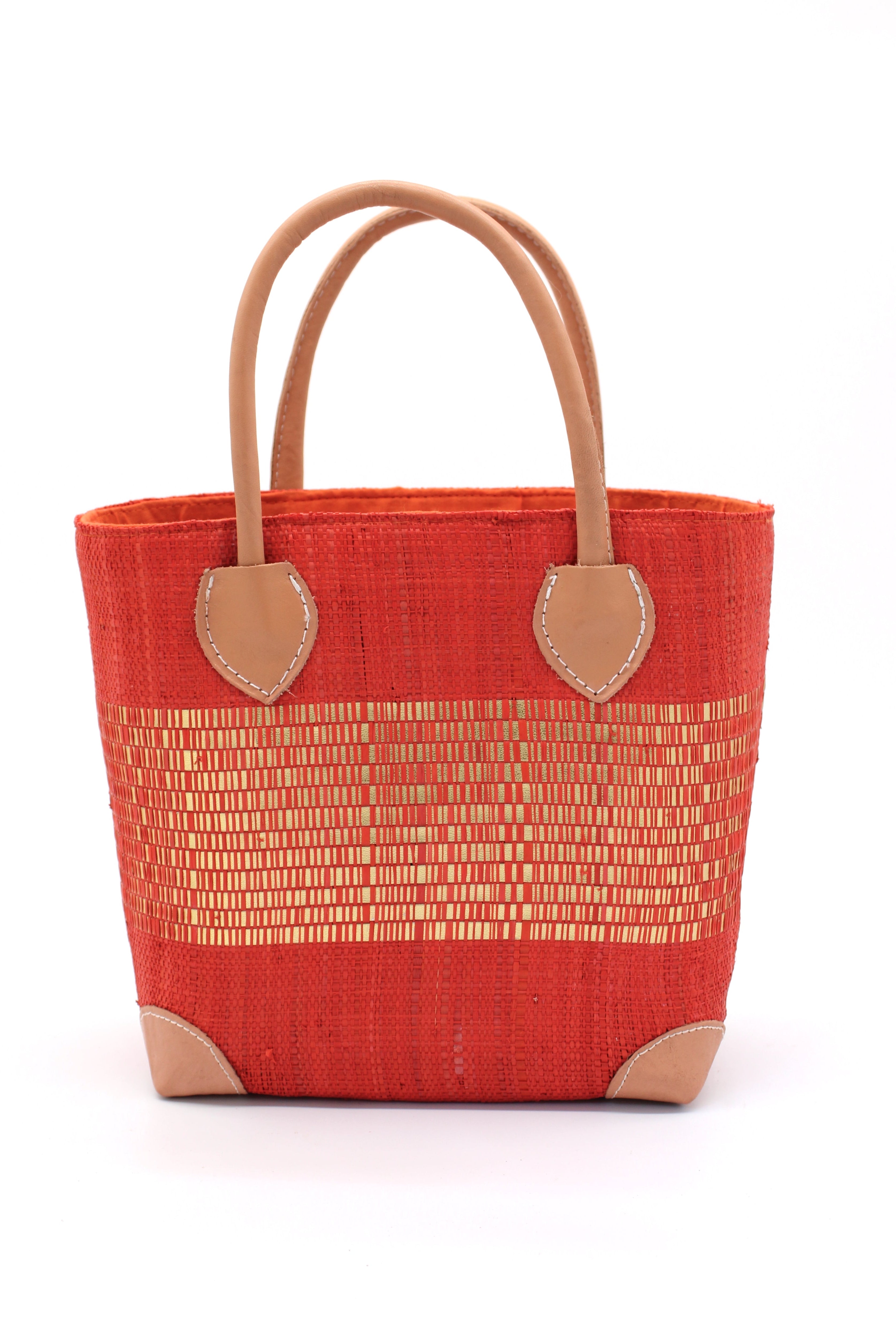 Wynwood Coral Straw Basket Bag with Metallic Detailing Handmade loomed raffia palm fiber in a solid hue of coral orange/red with a wide horizontal band of metallic strands woven in seamlessly handbag purse with leather handles - Shebobo