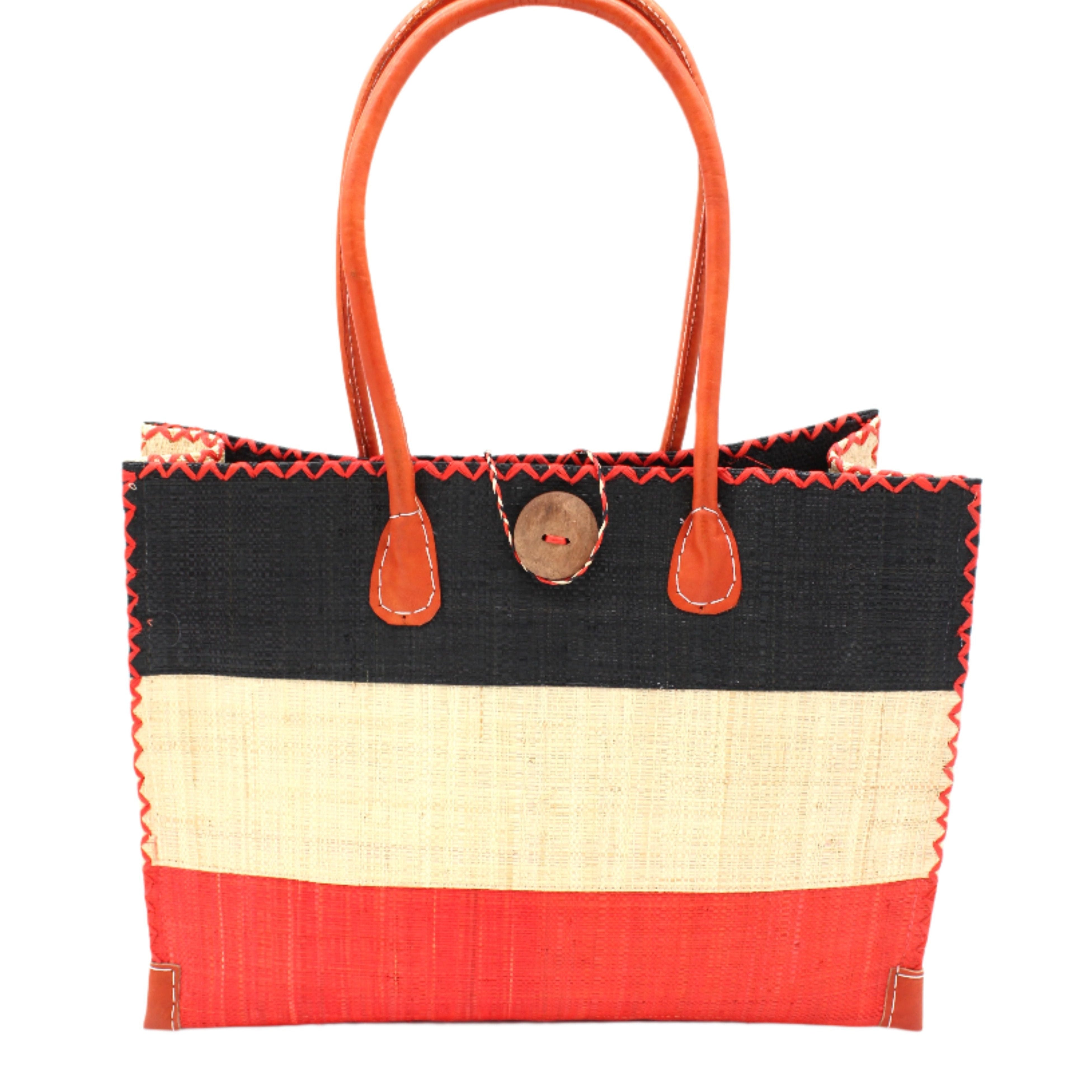 Zafran 3 Tone Color Block Beach Straw Bag with Plastic Liner handmade loomed raffia palm fiber in three equally sized horizontal bands of black, natural straw color, and coral red/orange with wood button and leather handles - Shebobo