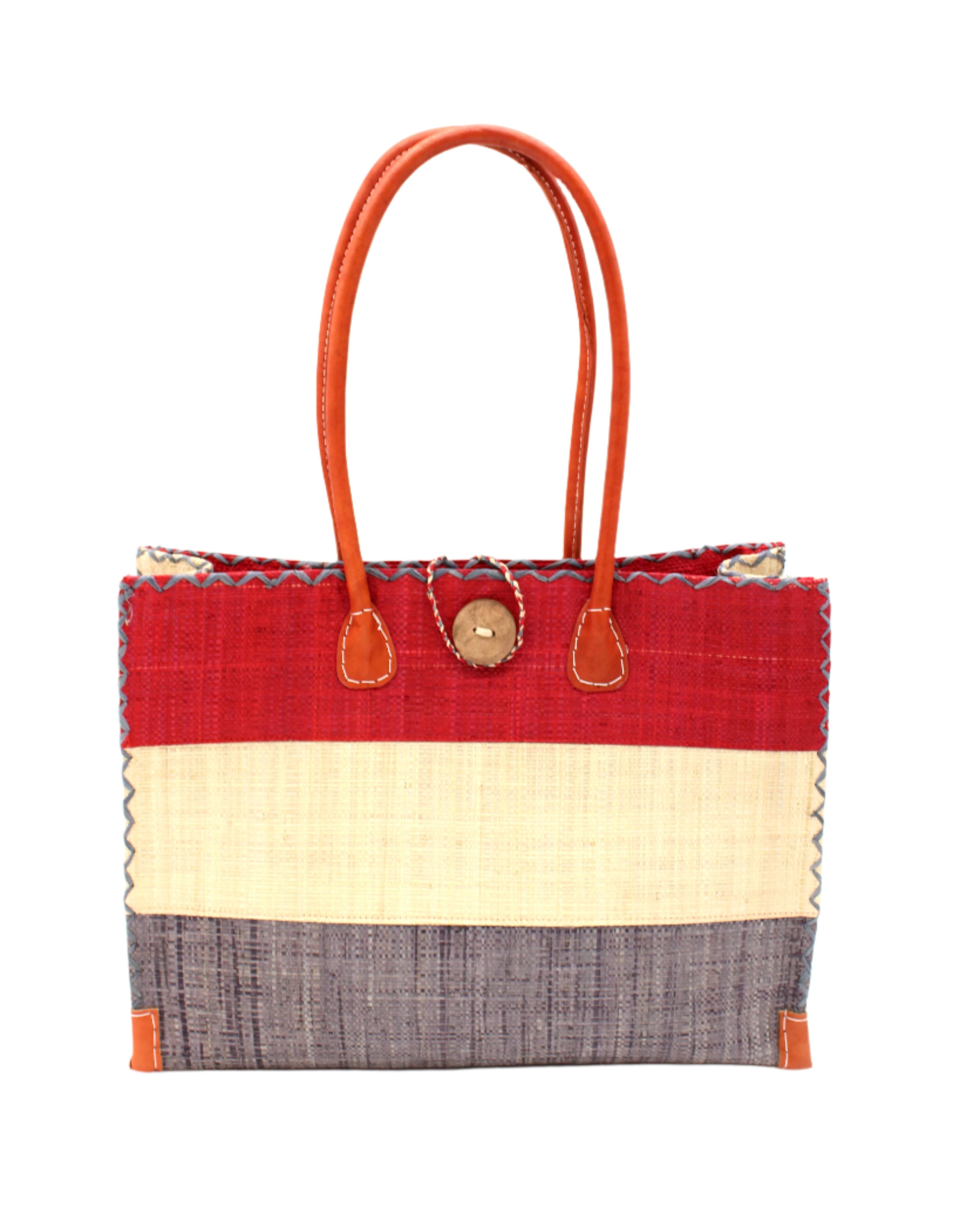 Zafran 3 Tone Color Block Beach Straw Bag with Plastic Liner handmade loomed raffia palm fiber in three equally sized horizontal bands of red, natural straw color, and grey with wood button and leather handles - Shebobo