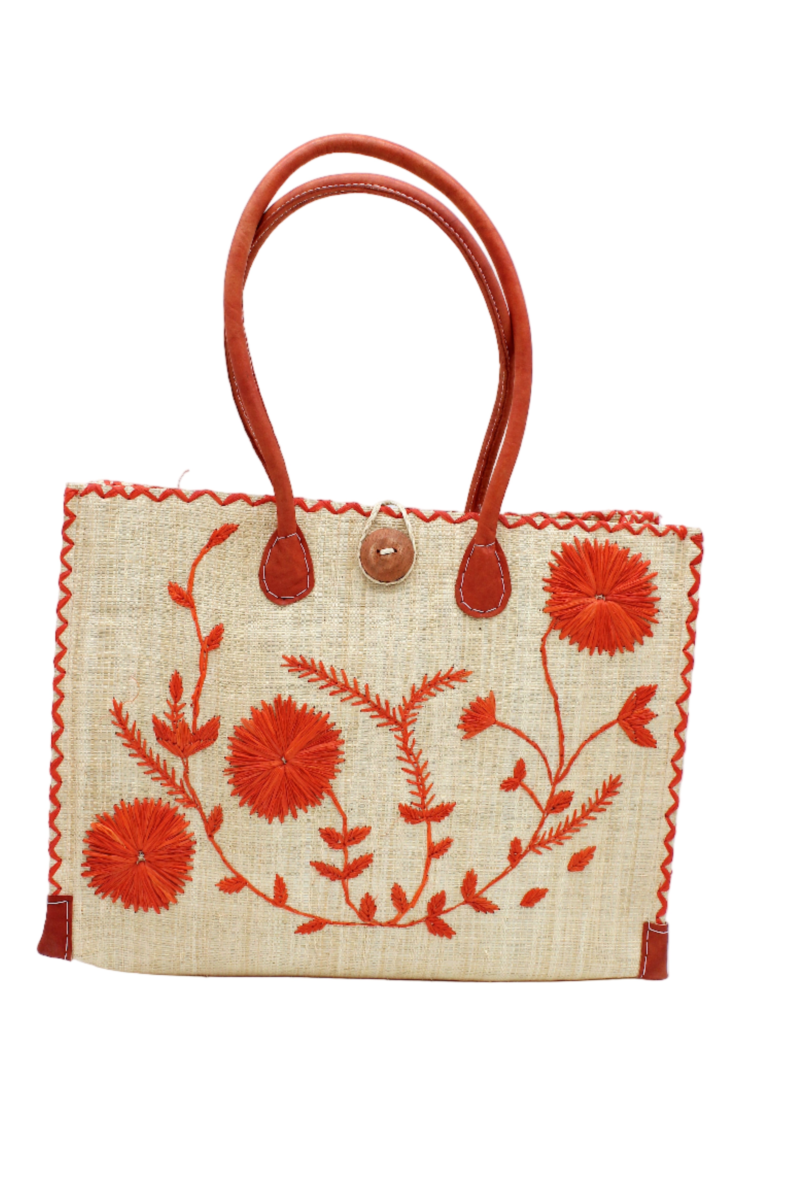 Zafran Natural & Coral Embroidered Straw Beach Bag with Floral Pattern handmade natural raffia palm fiber in a solid hue of natural straw color with asymmetrical floral leaf, vine, and flower pattern in coral orange/red with matching cross-stitch edging, leather handles, and wooden button closure shoulder bag handbag tote - Shebobo