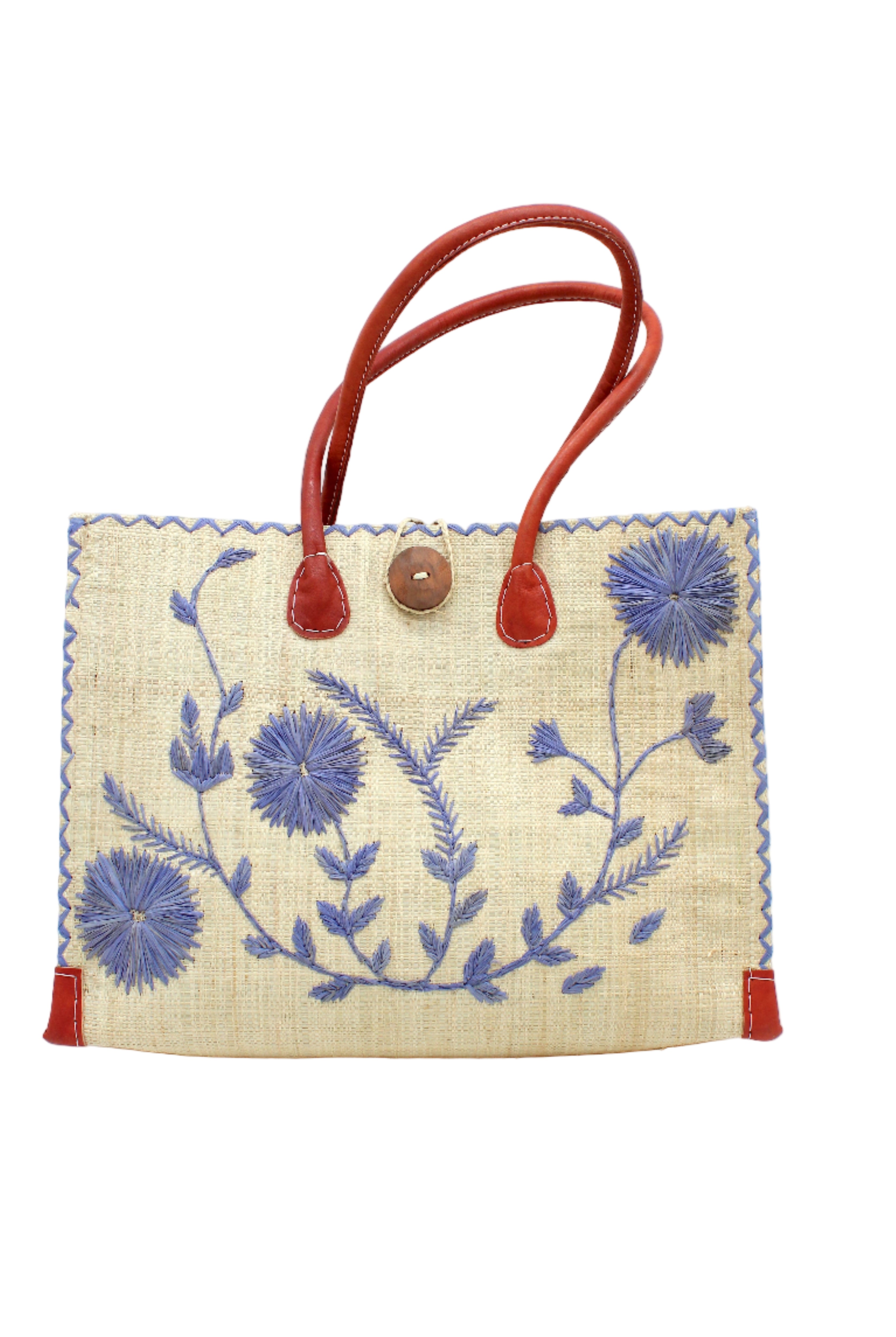 Zafran Natural & Denim Embroidered Straw Beach Bag with Floral Pattern handmade natural raffia palm fiber in a solid hue of natural straw color with asymmetrical floral leaf, vine, and flower pattern in denim retro/light/blue with matching cross-stitch edging, leather handles, and wooden button closure shoulder bag handbag tote - Shebobo
