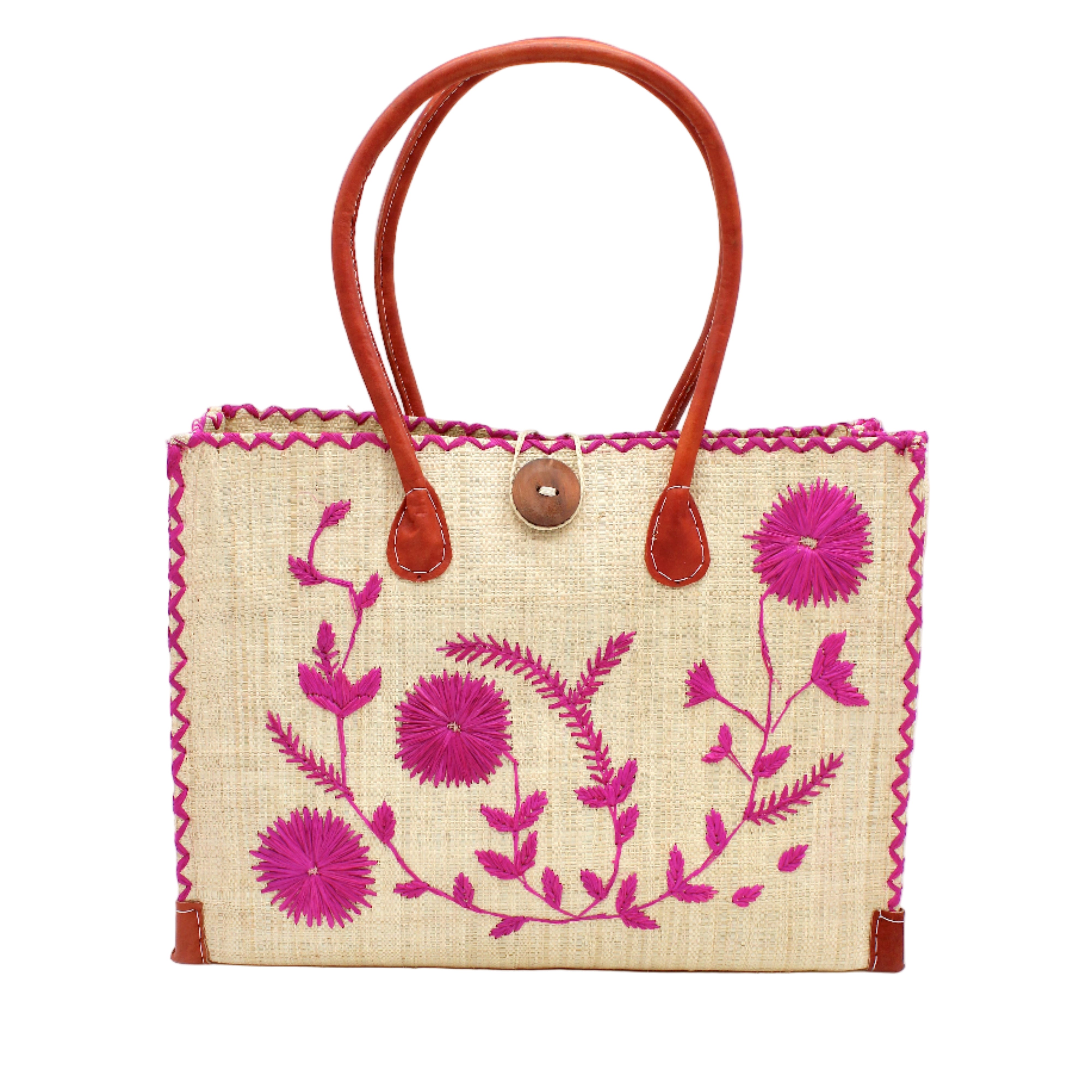 Zafran Natural & Fuchsia Embroidered Straw Beach Bag with Floral Pattern handmade natural raffia palm fiber in a solid hue of natural straw color with asymmetrical floral leaf, vine, and flower pattern in fuchsia hot/bright/barbie/pink with matching cross-stitch edging, leather handles, and wooden button closure shoulder bag handbag tote - Shebobo